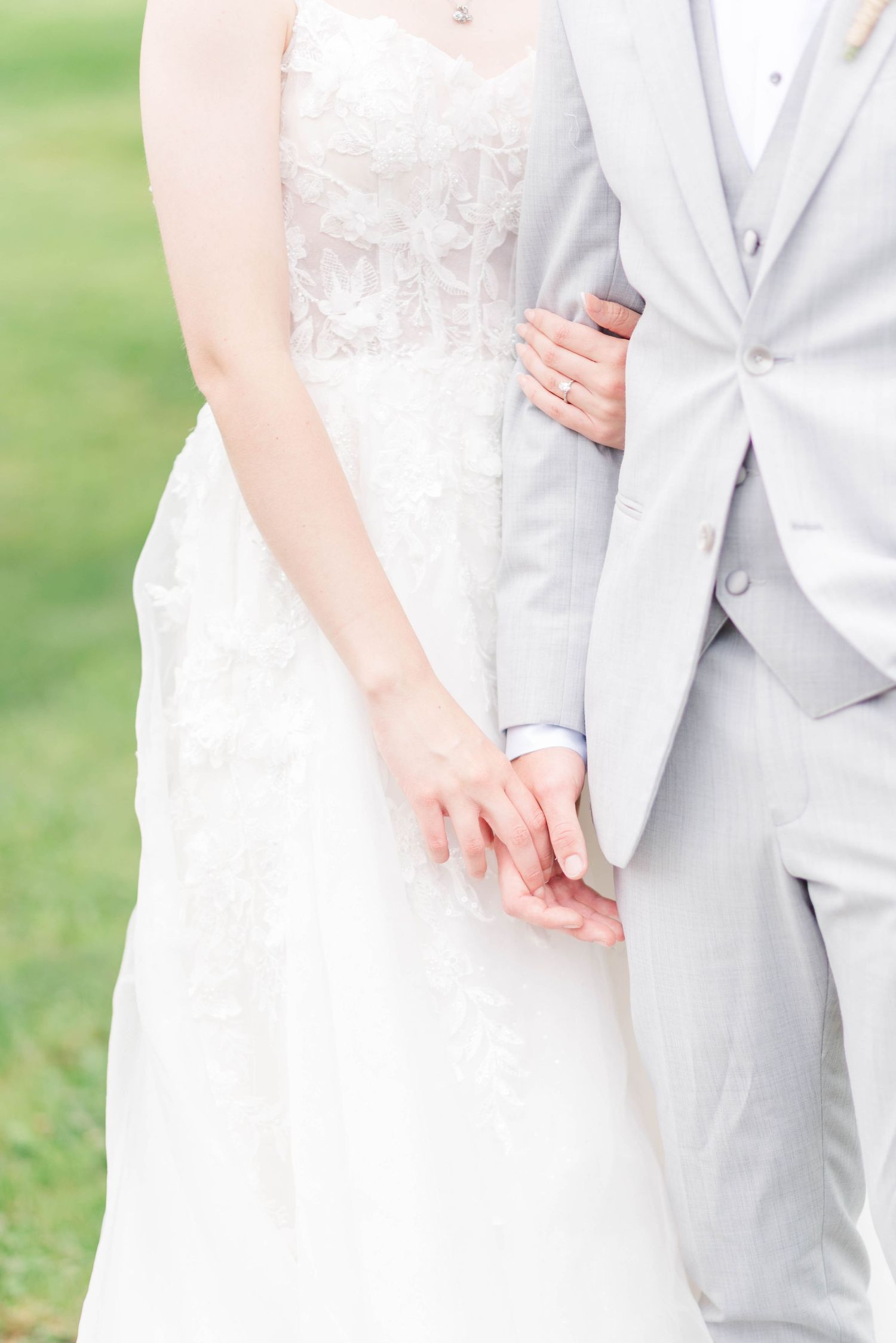 Bride and groom holding hands at Joiner Farms in Northern Cambria, Pennsylvania