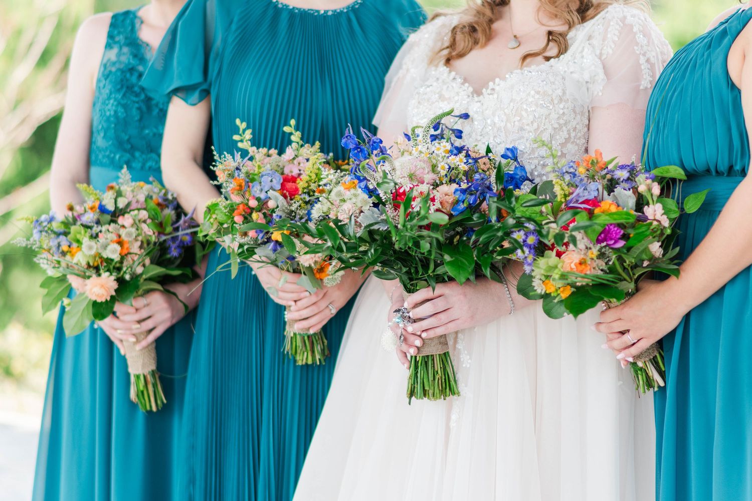 Bridal party holding bouquets at the Roost in Mahaffey, Pennsylvania