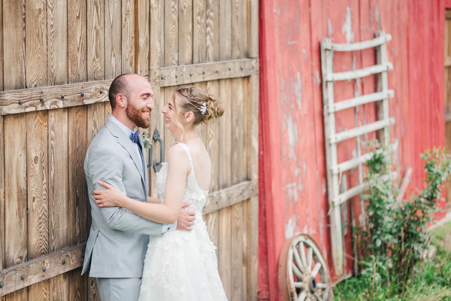Bride and groom beside the barn at Joiner Farms in Northern Cambria, Pennsylvania