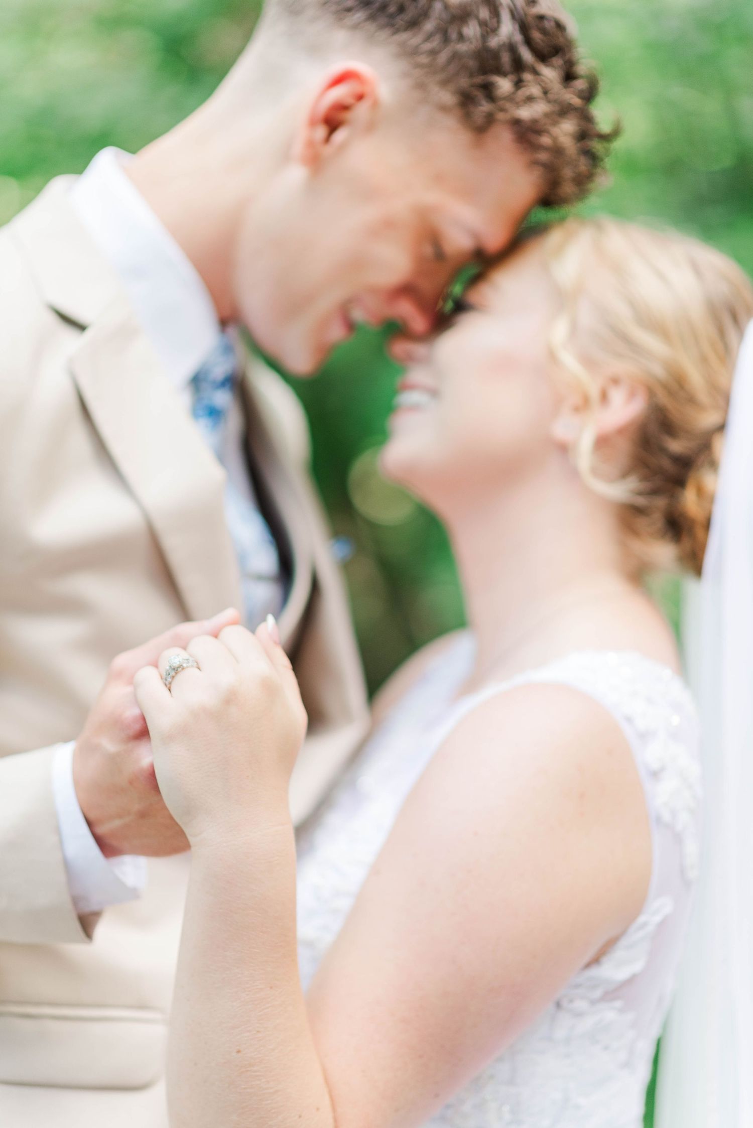 Bride and groom with wedding rings in Ligonier, Pennsylvania