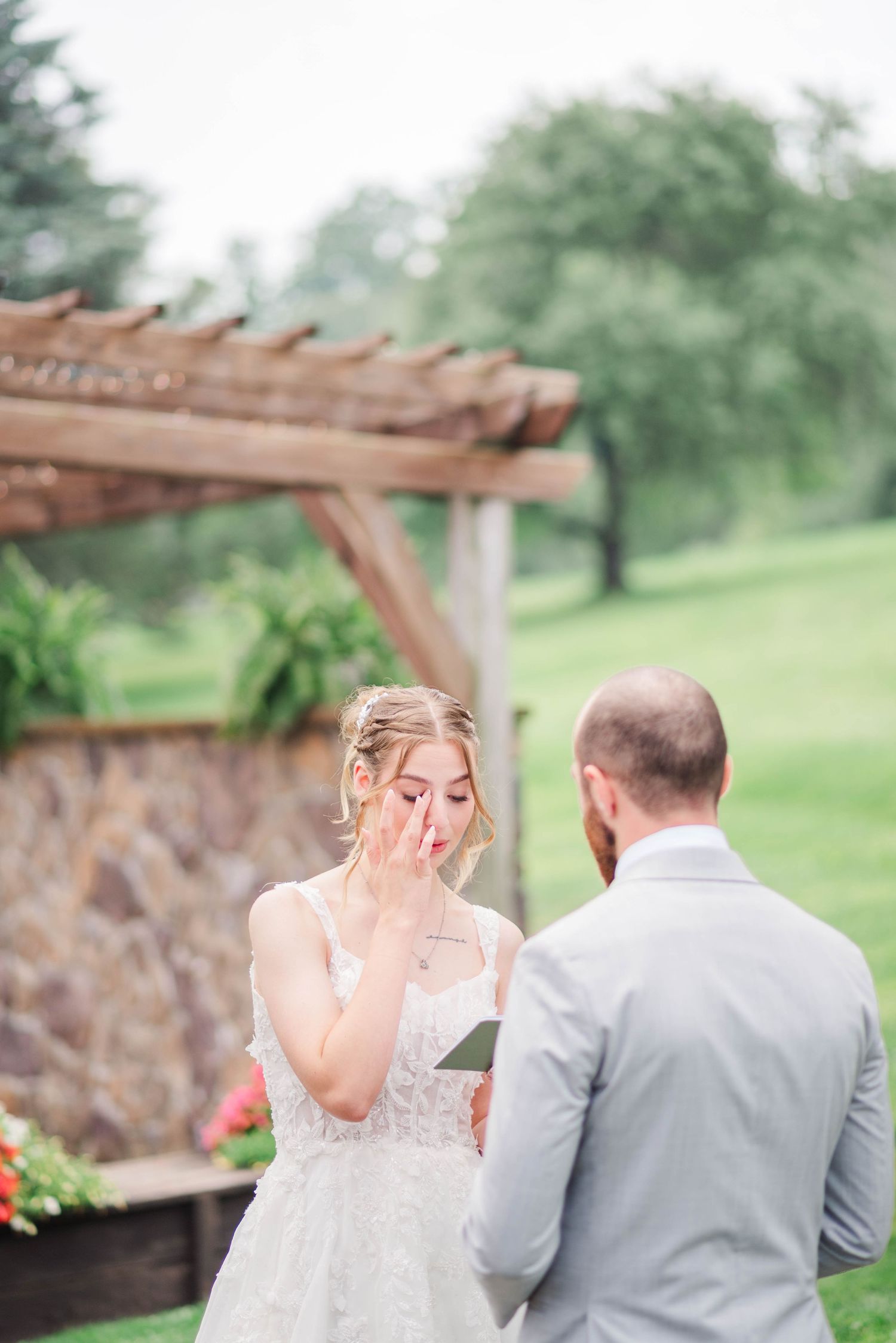 Bride reading vows at first look at Joiner Farms in Northern Cambria, Pennsylvania