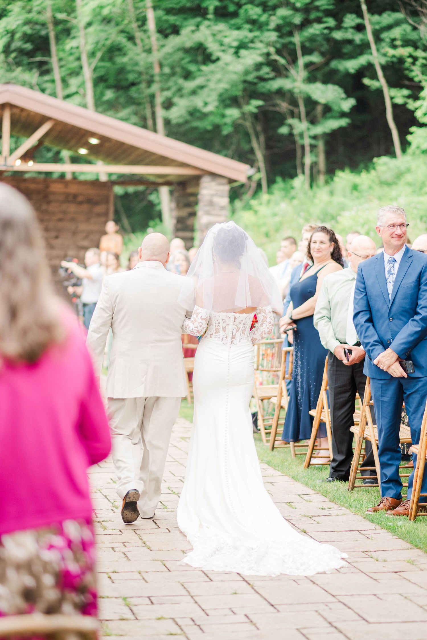 Walking down the aisle at Whispering Hollow Estates in Pleasantville, Pennsylvania