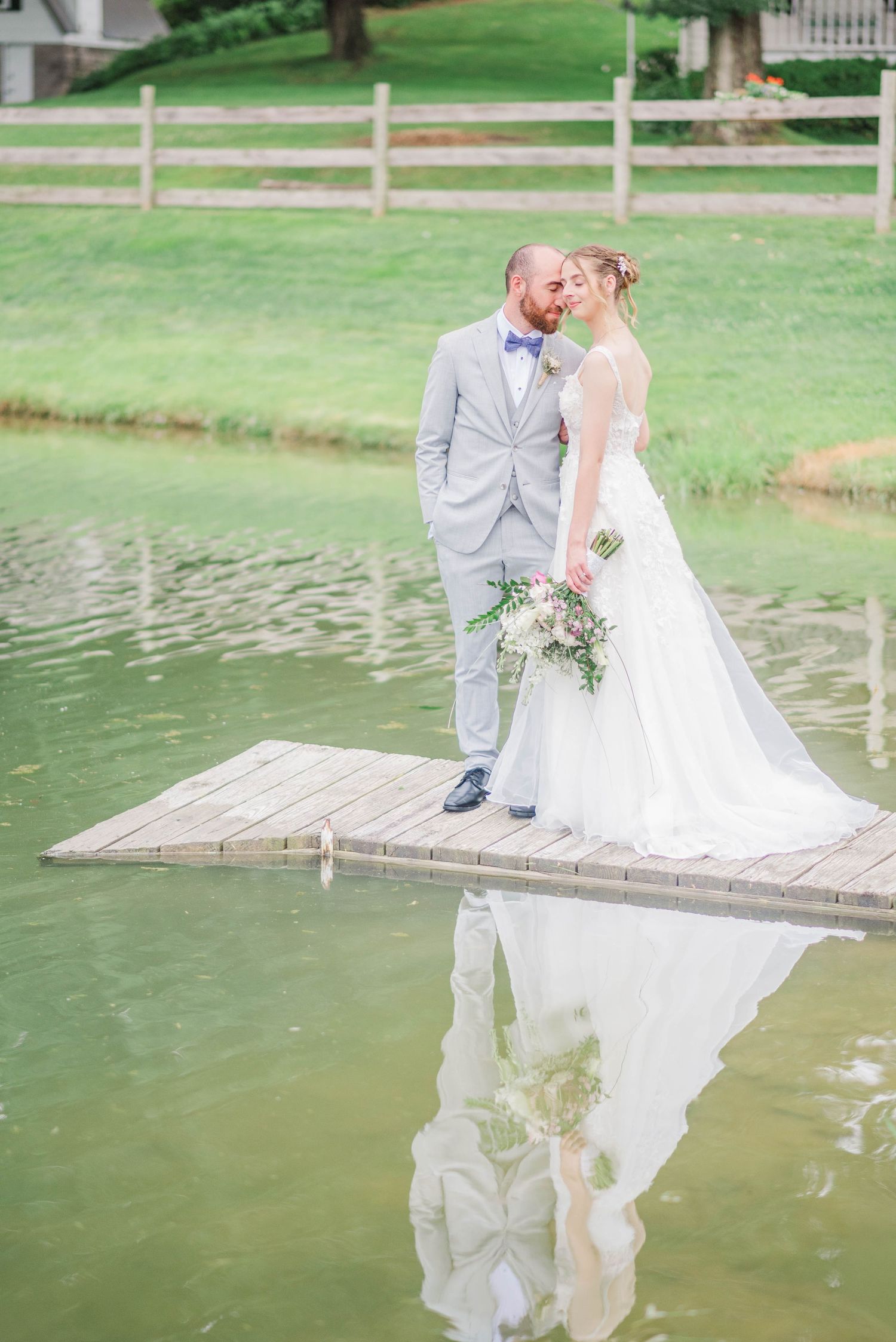 Bride and groom next to lake at Joiner Farms in Northern Cambria, Pennsylvania