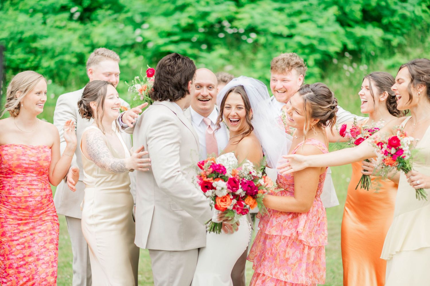 Bride and groom surrounded by bridal party at Whispering Hollow Estates in Pleasantville, Pennsylvania