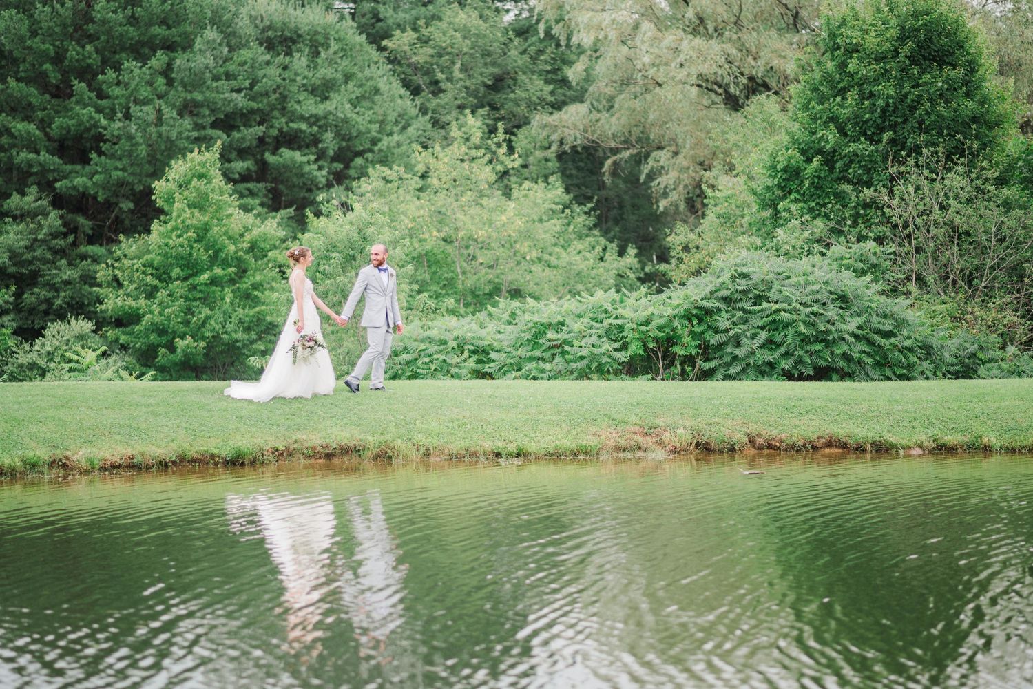 Couple walking next to lake at Joiner Farms in Northern Cambria, Pennsylvania