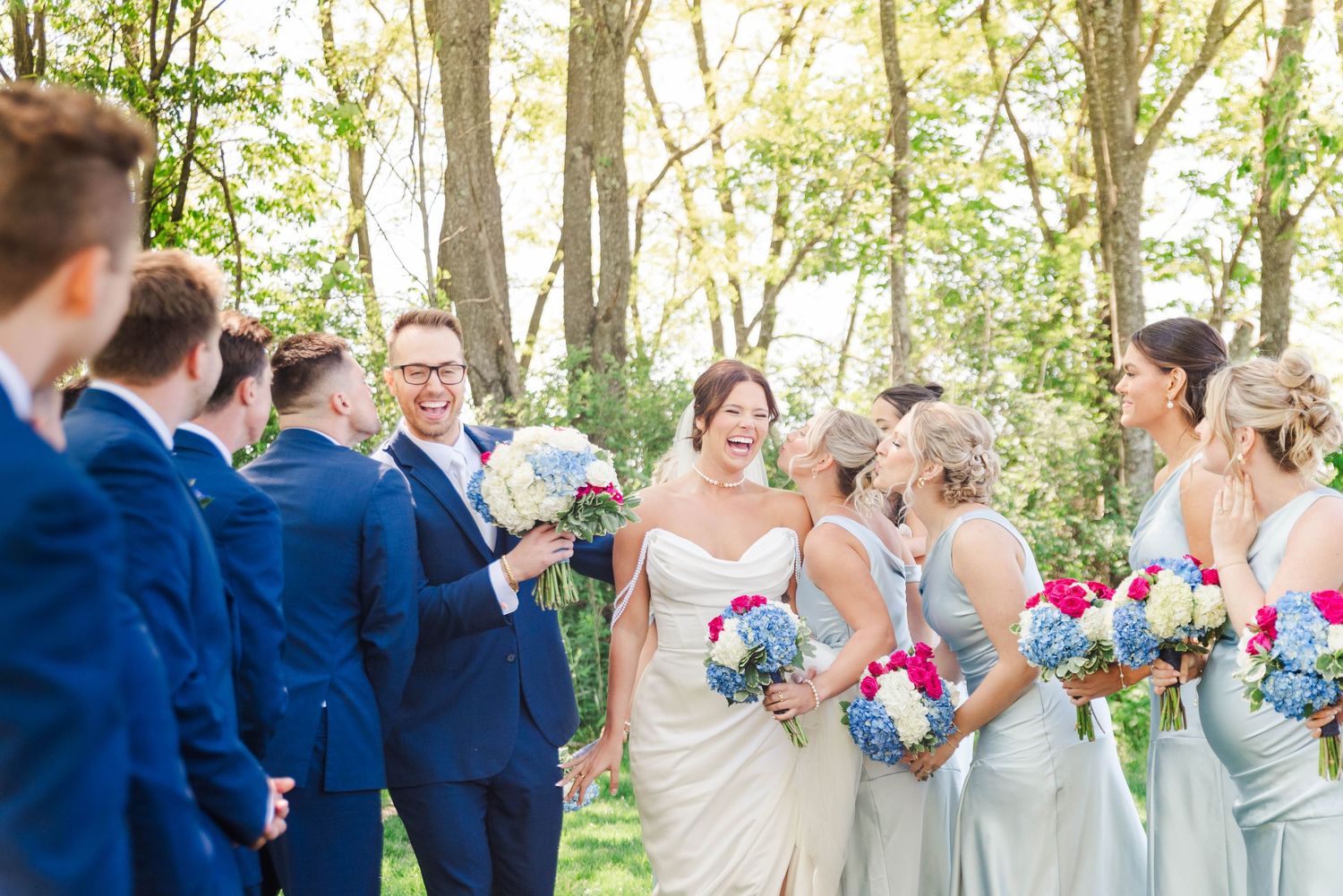 Bride and groom between bridal party at the Willow in Johnstown, Pennsylvania
