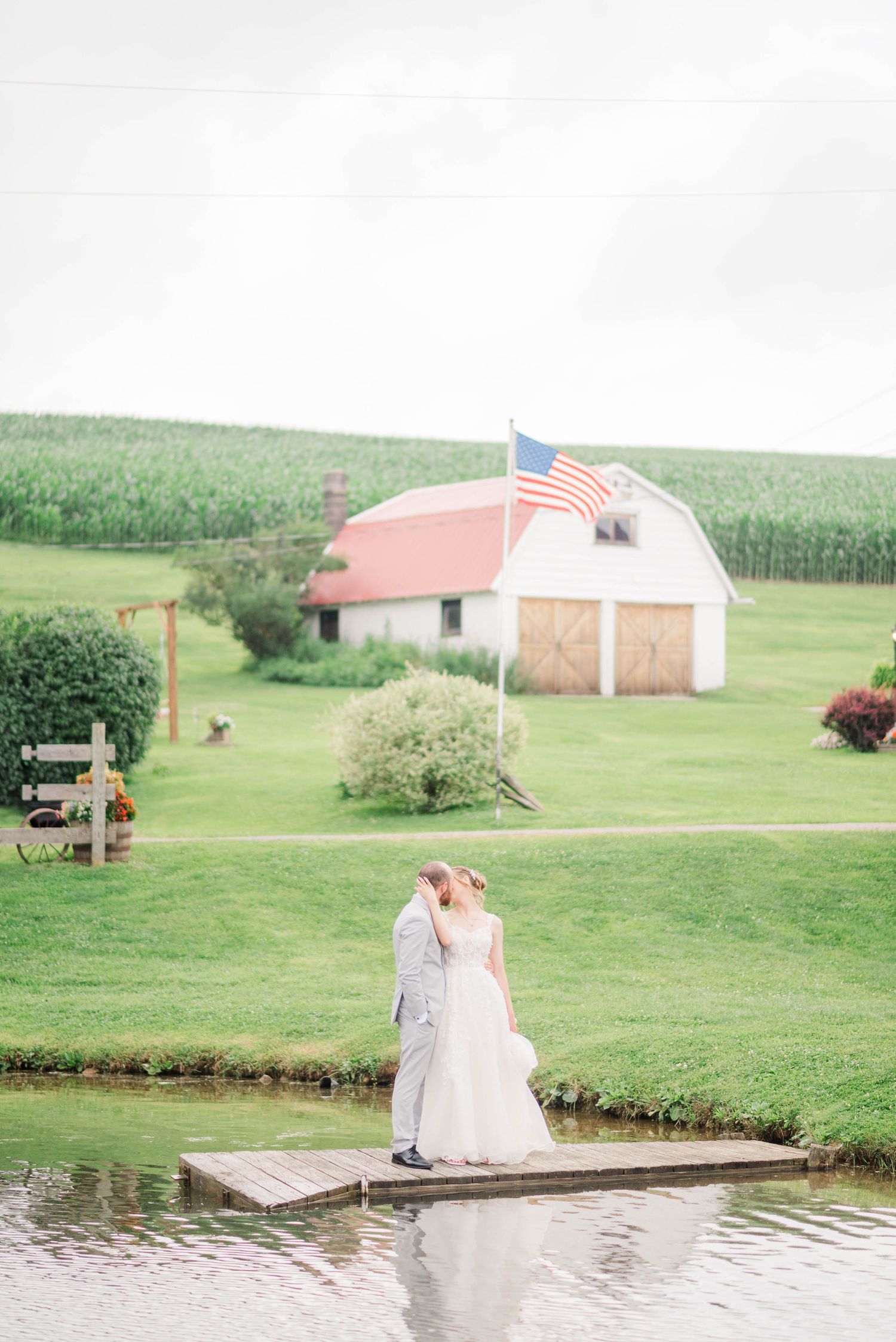 Bride and groom next to lake at Joiner Farms in Northern Cambria, Pennsylvania