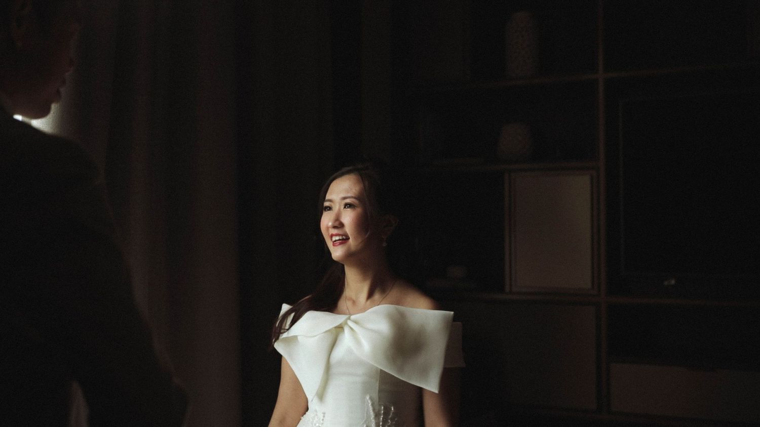 bride smiling at groom captured by Singapore wedding videographer