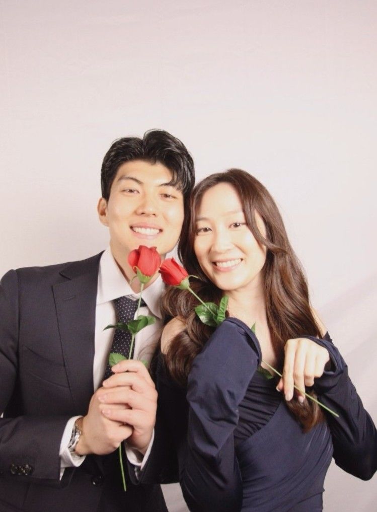 A couple posing for a photo in our Sydney standard-angle photobooth hire.