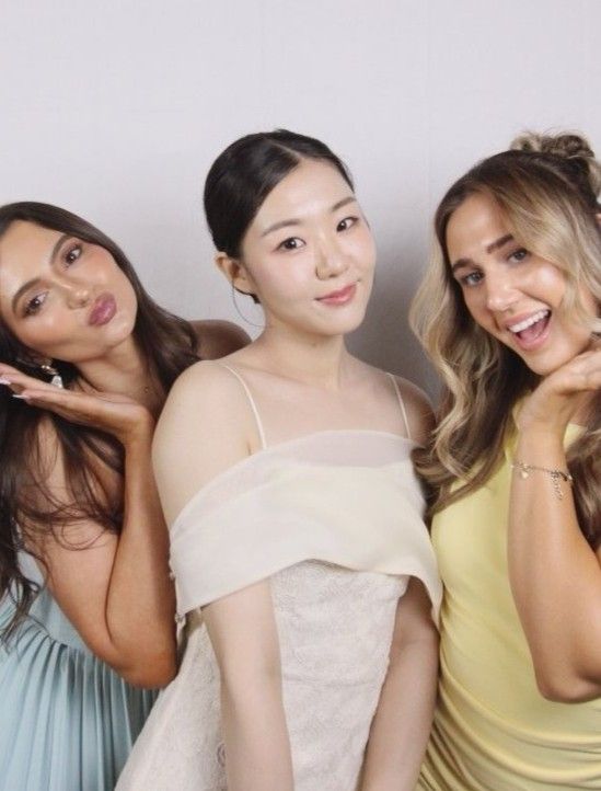 Small group of friends posing for a classic photo in our Sydney standard-angle photobooth.
