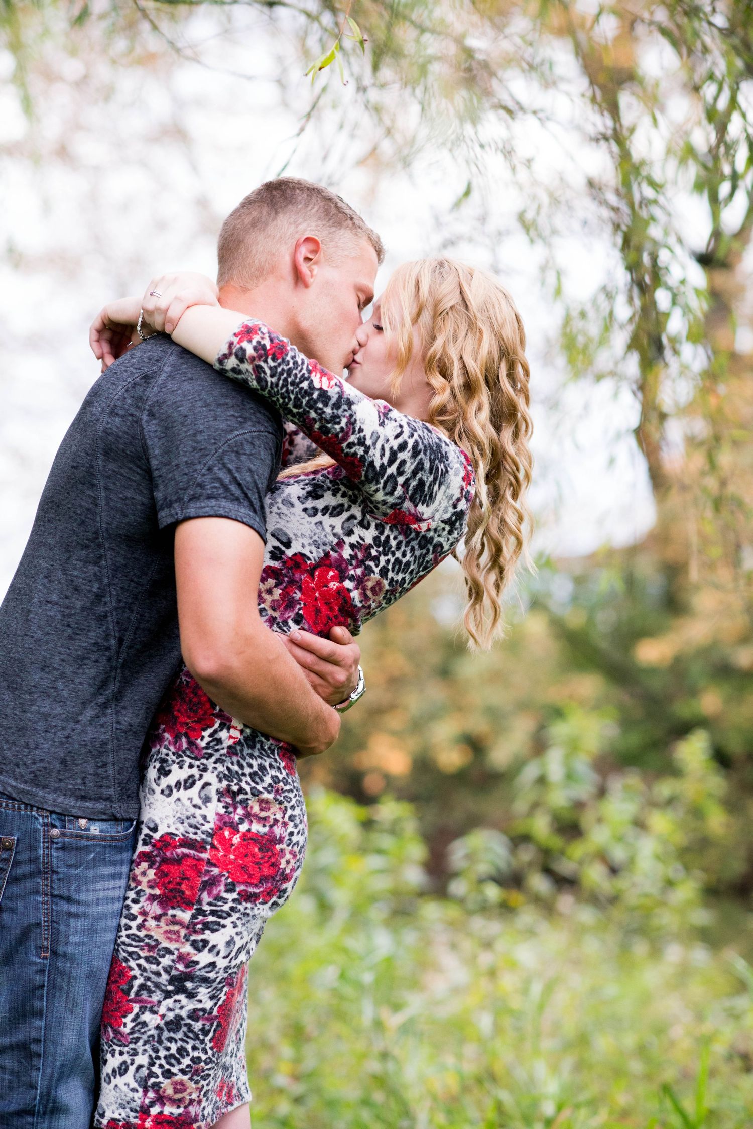 Couple sharing a kiss during an engagement session in Chilliwack, British Columbia.