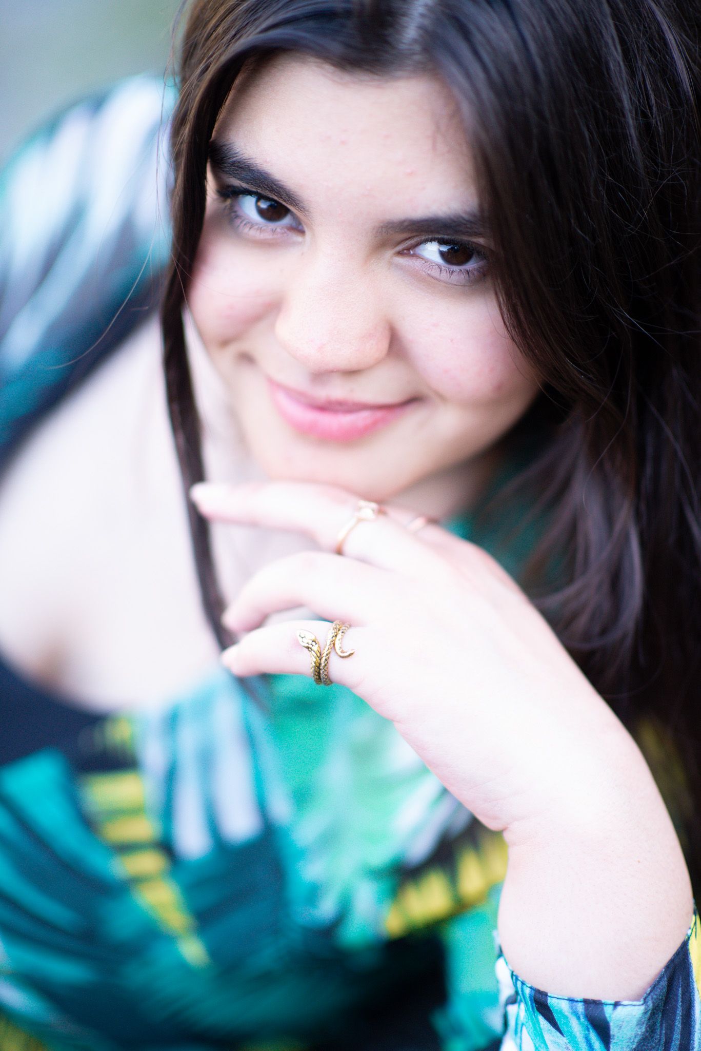 Outdoor graduation portrait of a smiling teenage girl in Chilliwack, British Columbia.