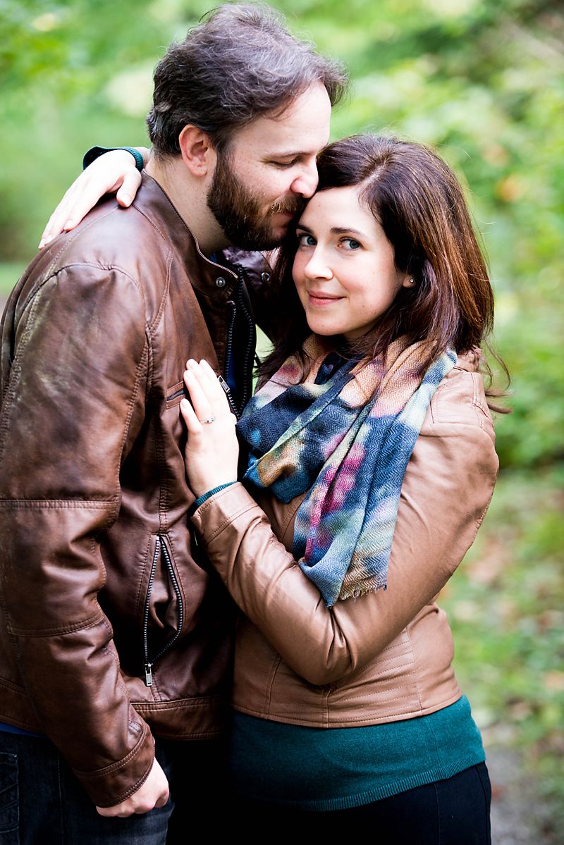 Couple embracing during an autumn engagement session in British Columbia.
