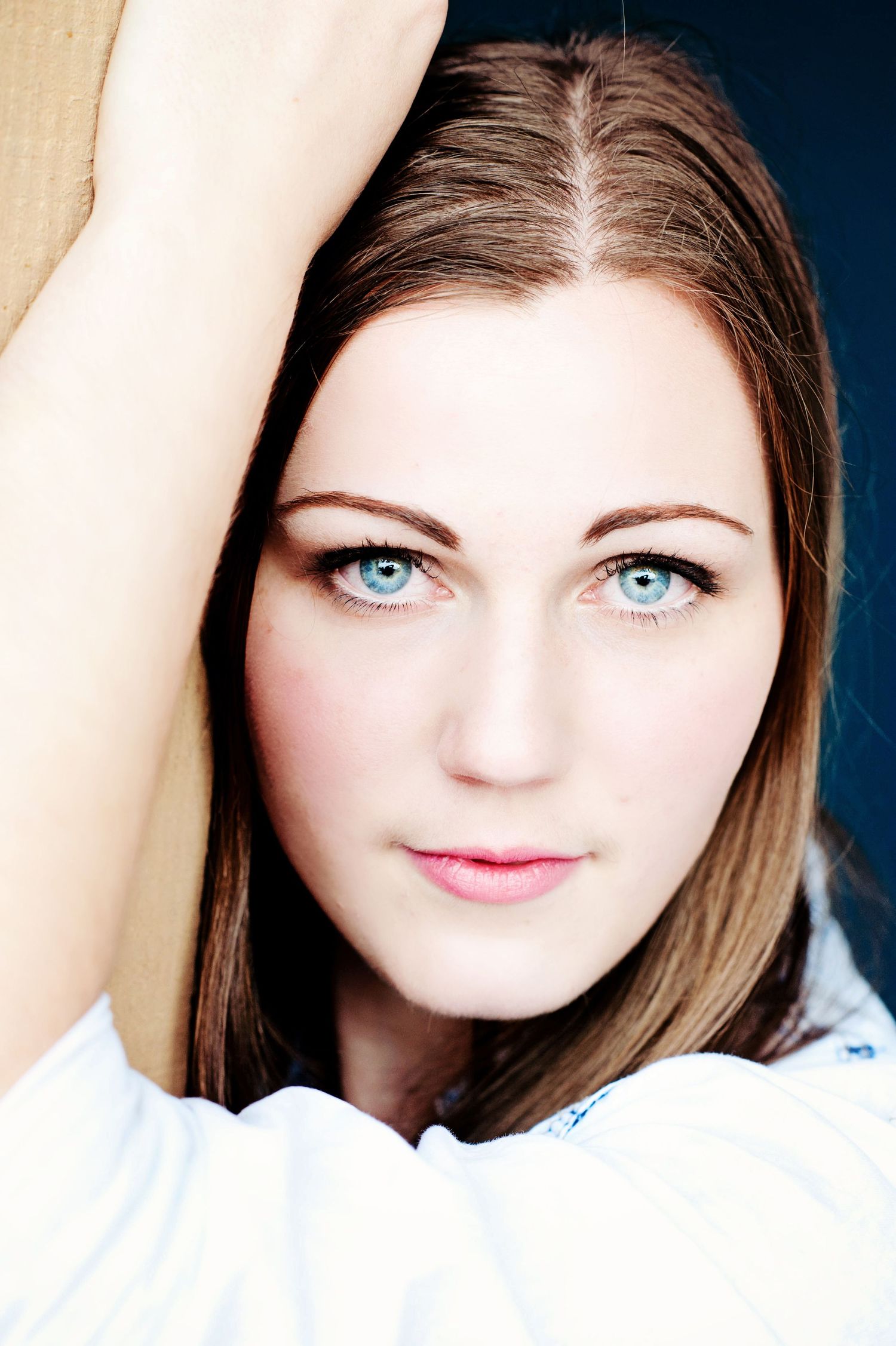 Graduation portrait of a young woman with blue eyes in Chilliwack, British Columbia.