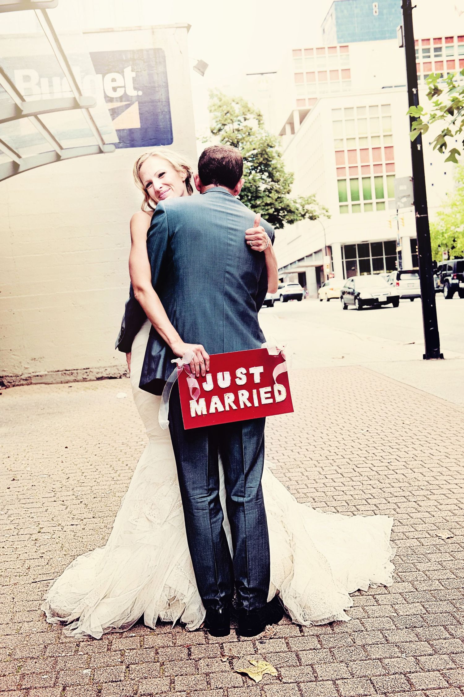 Newlyweds embracing with a 