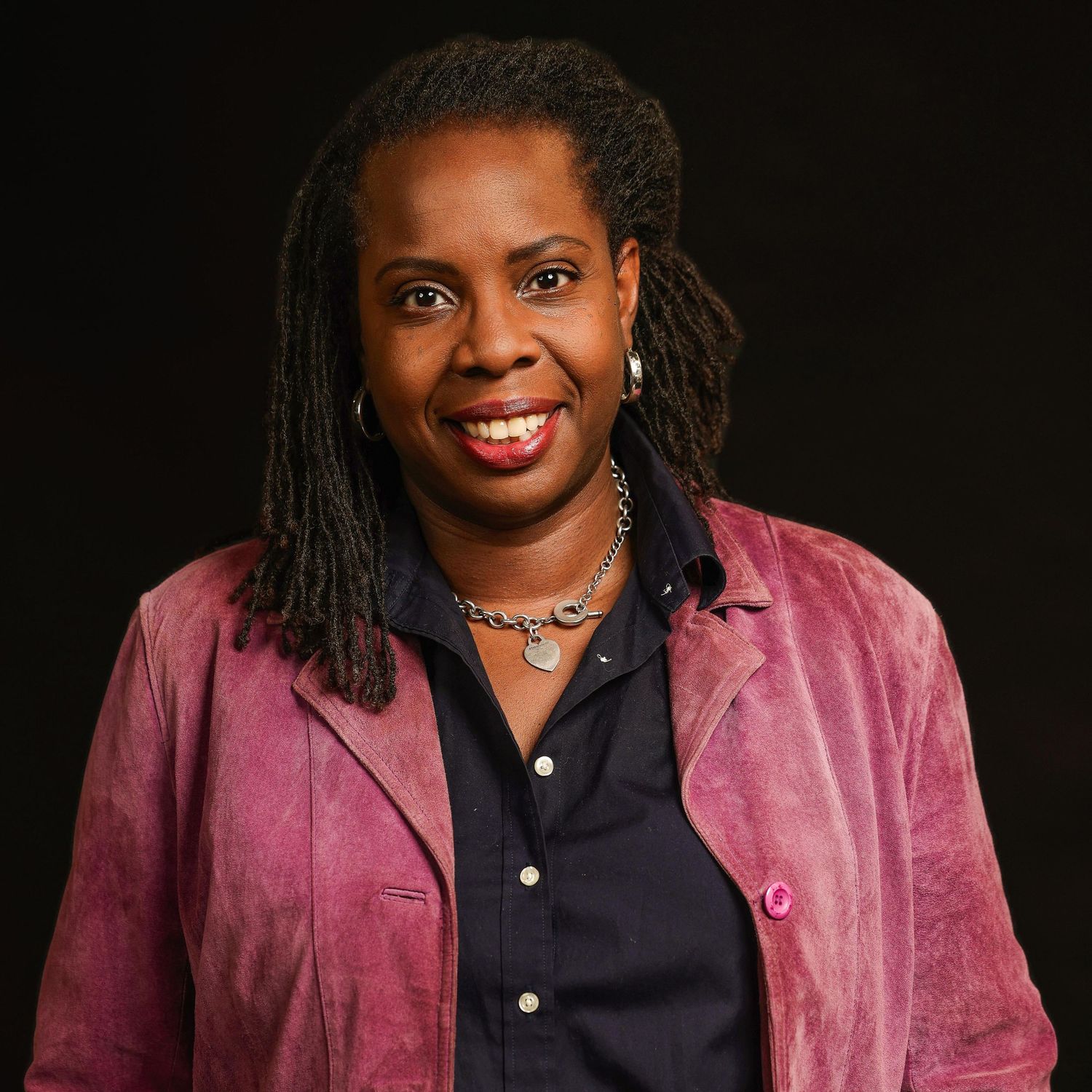 Professional headshot capturing approachable presence and leadership identity for corporate branding and media use