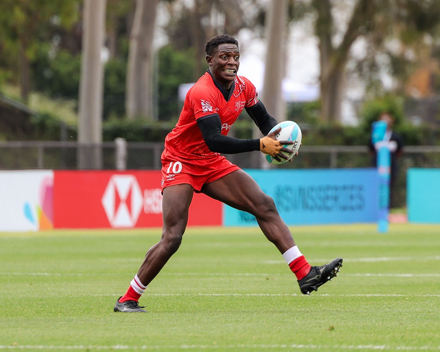 Rugby sports photography in Atlanta capturing evasive movement during live match action and athlete performance