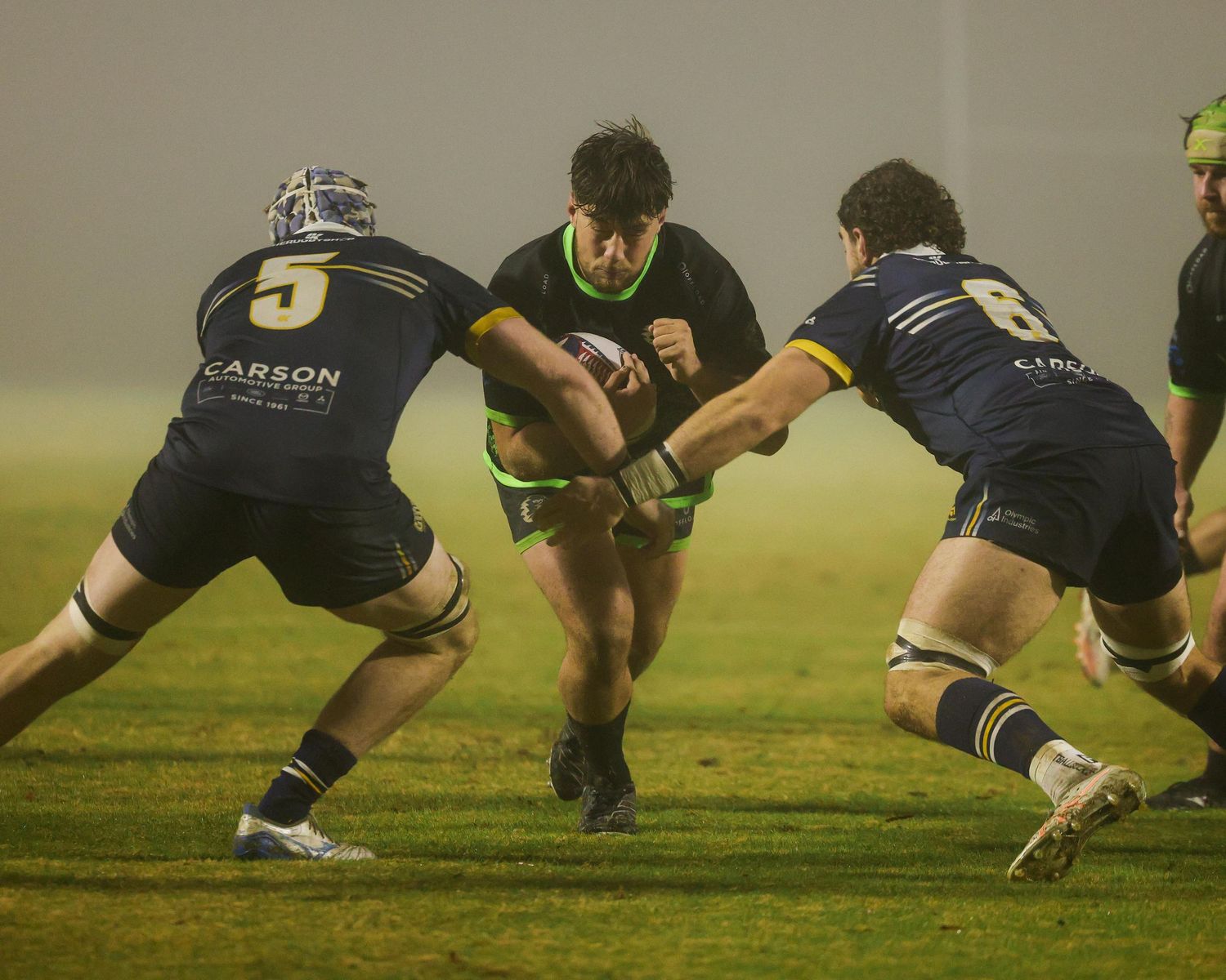 Rugby sports photography in Atlanta capturing live match collision and team performance under pressure