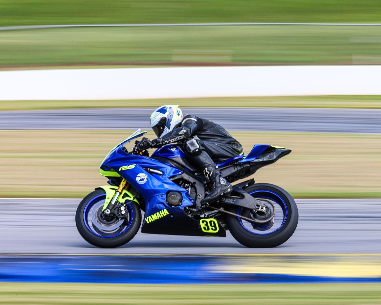 Sports photography capturing high-speed motorcycle action with motion blur for motorsport media and marketing content