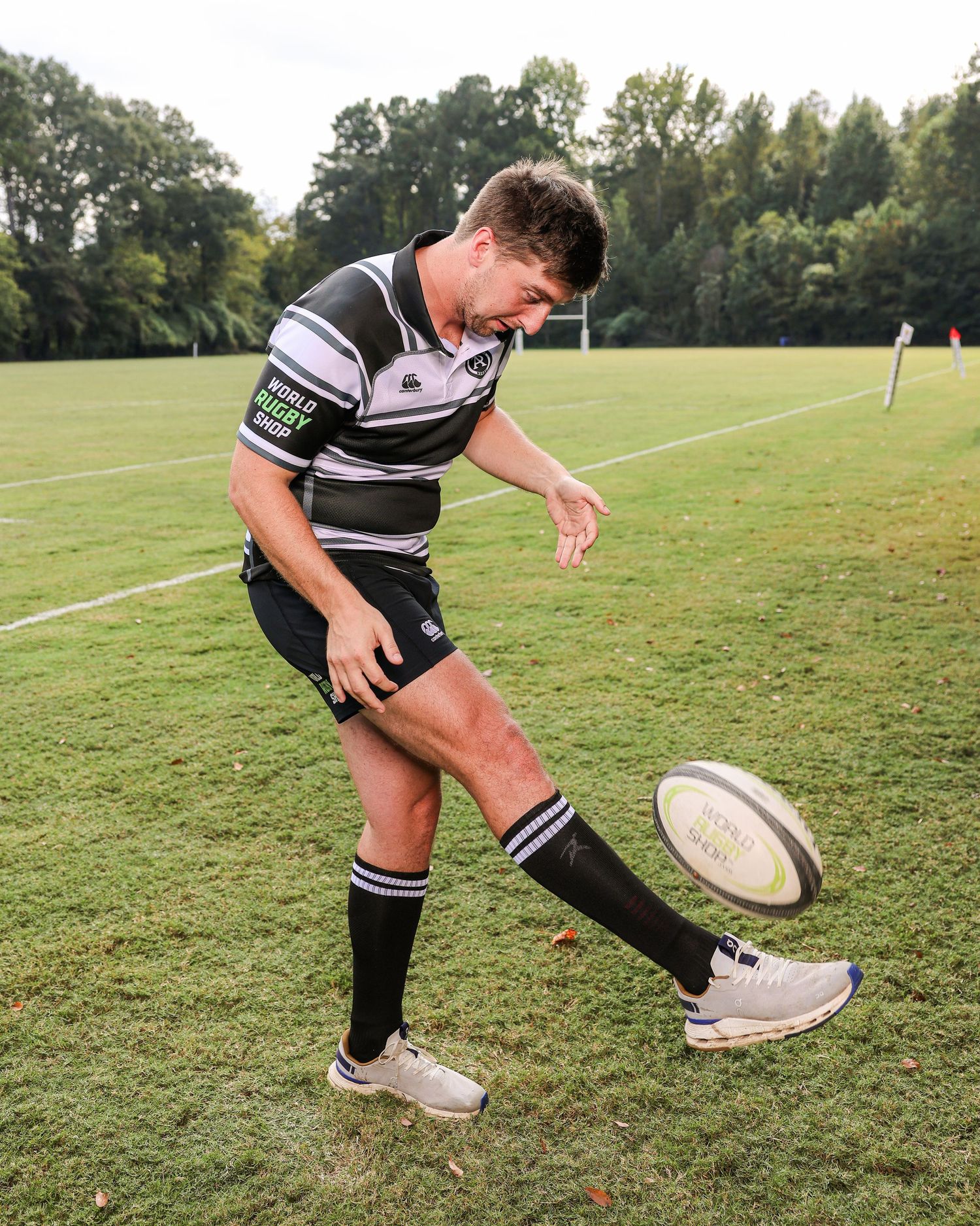 Rugby sports photography in Atlanta capturing skill development and kicking technique for athlete performance and training visibility