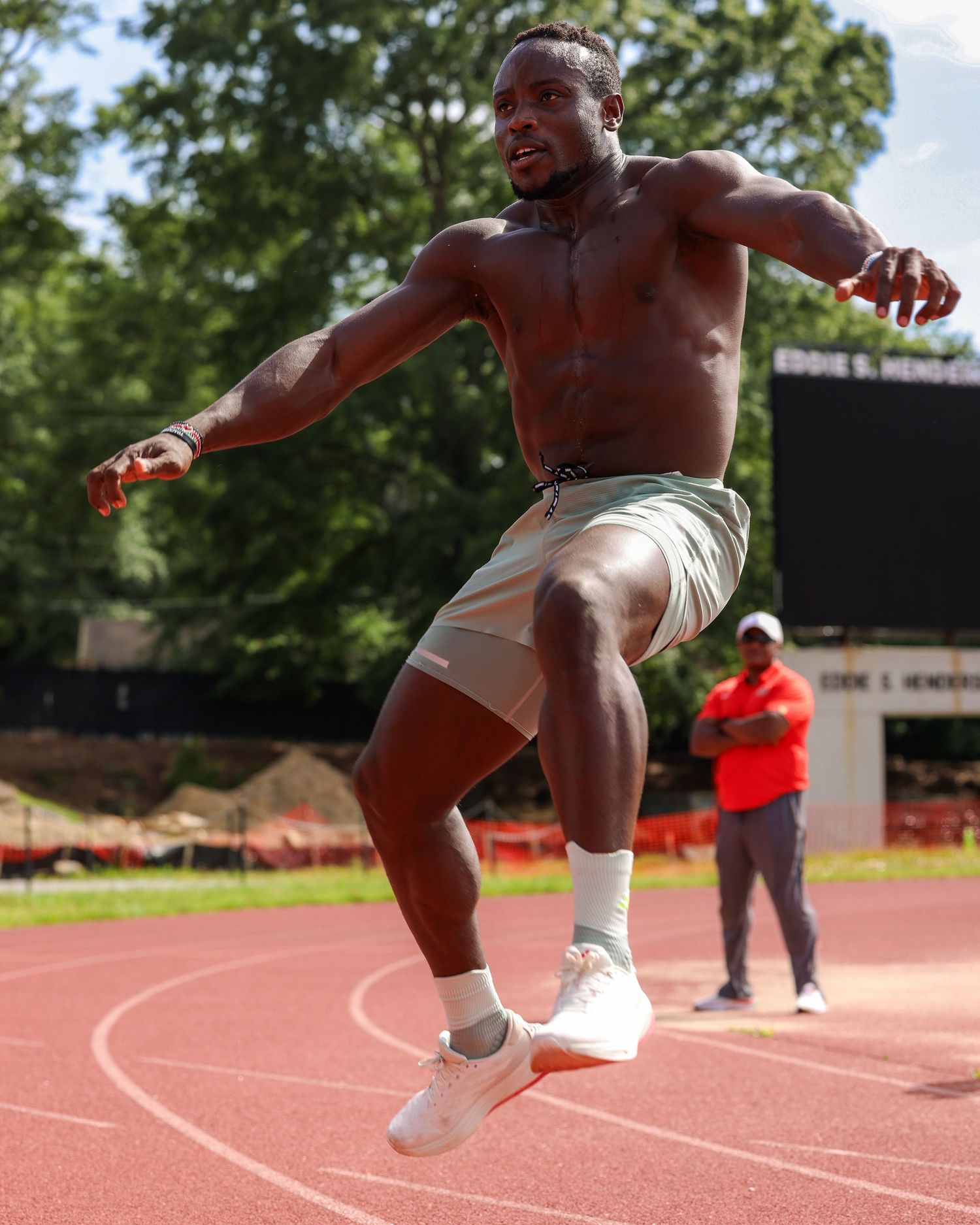 Sports photography in Atlanta capturing explosive track performance for athlete branding, training, and performance marketing content