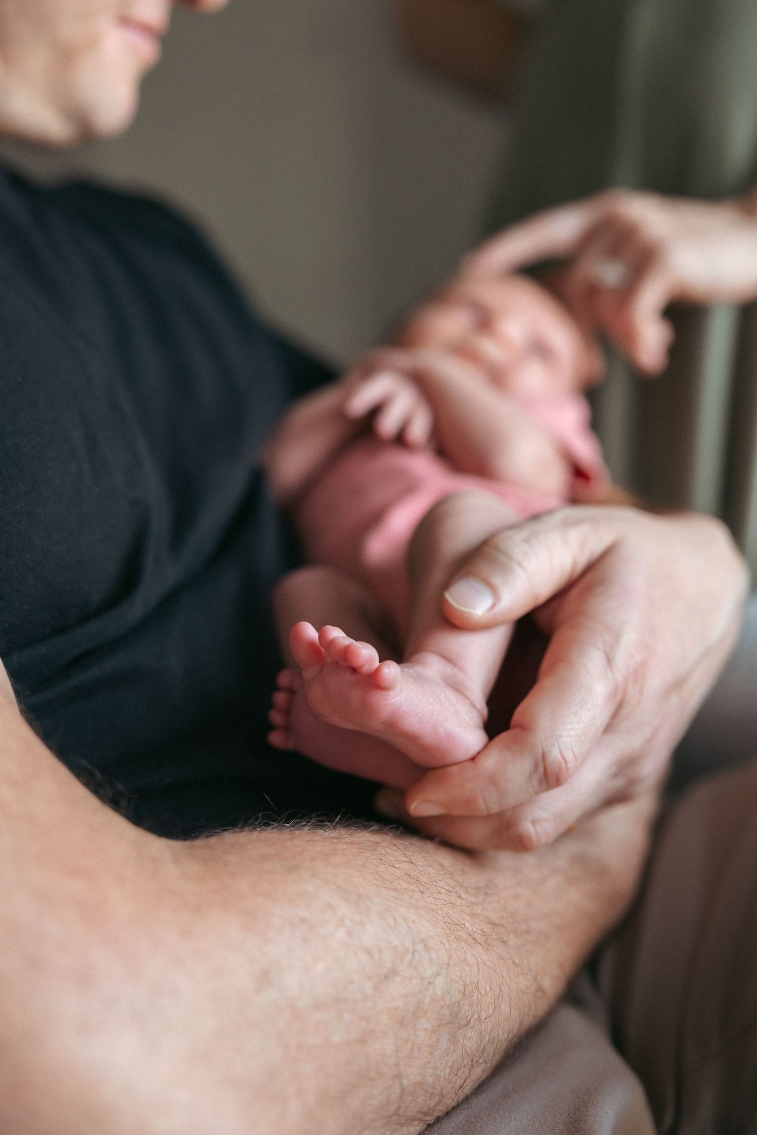 Close-up of hands performing a therapeutic massage on an arm using professional massage techniques.