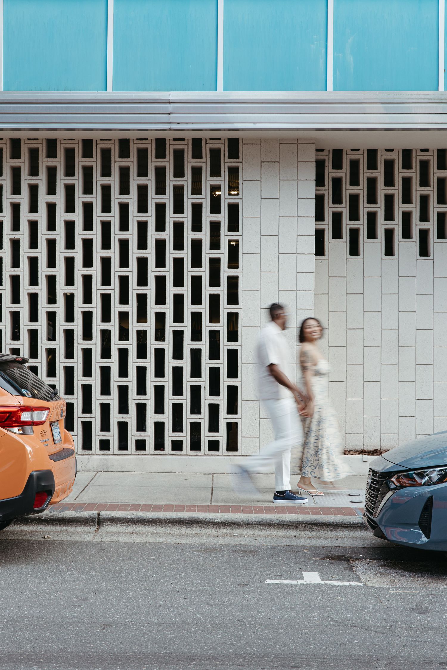 A sequence of motion blur shots showing someone running past a geometric patterned wall in an urban setting.