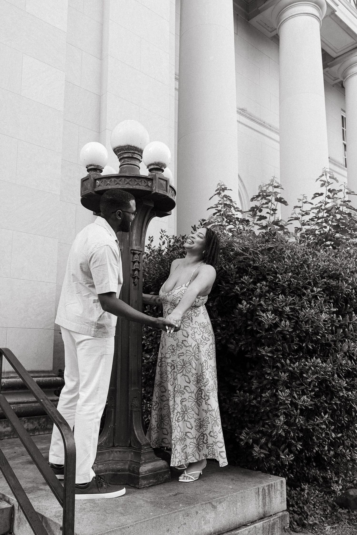 A couple in white and floral dress stand together on a porch with white columns and bushes in a sequence of photos.
