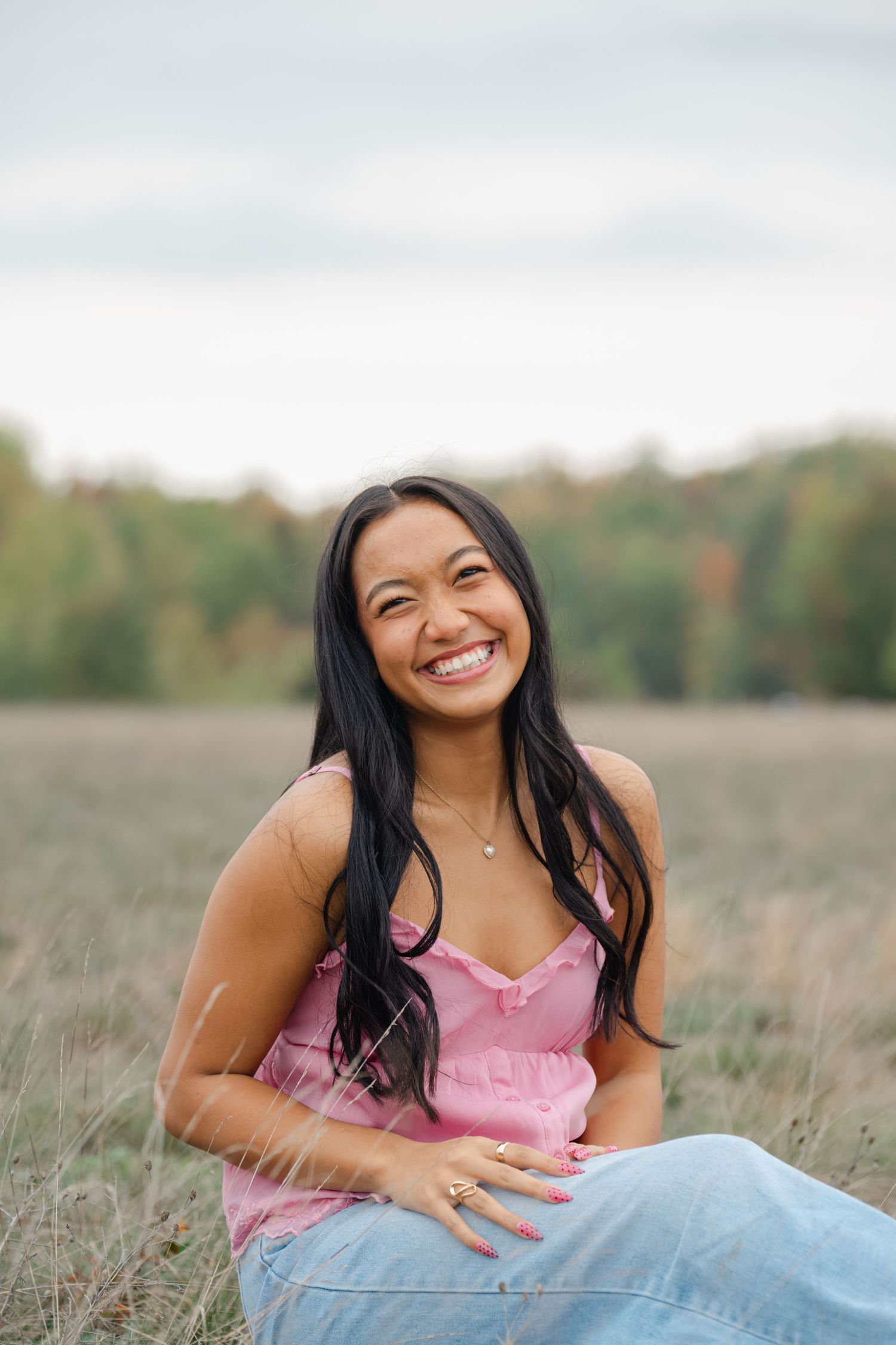 senior sitting on ground smiling