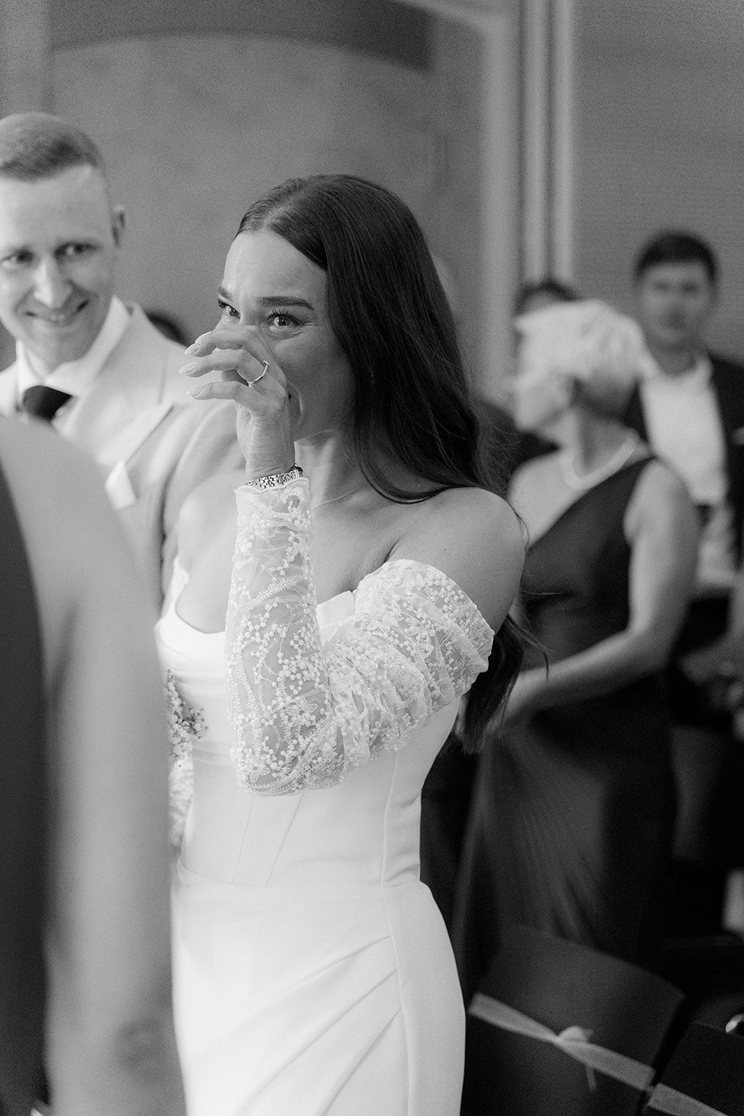 A sequence of black and white photos showing a bride in a lace dress during a wedding celebration.