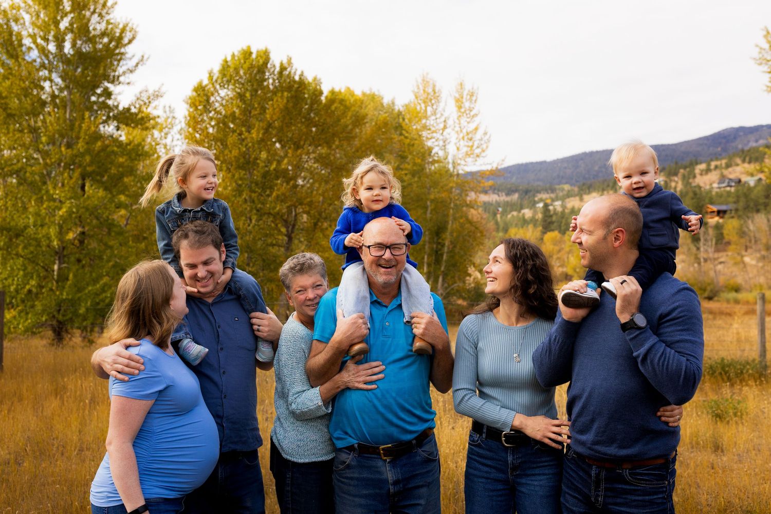 Joyful family photo of a large family laughing together, capturing authentic connection, love, and vibrant luxury family photography.