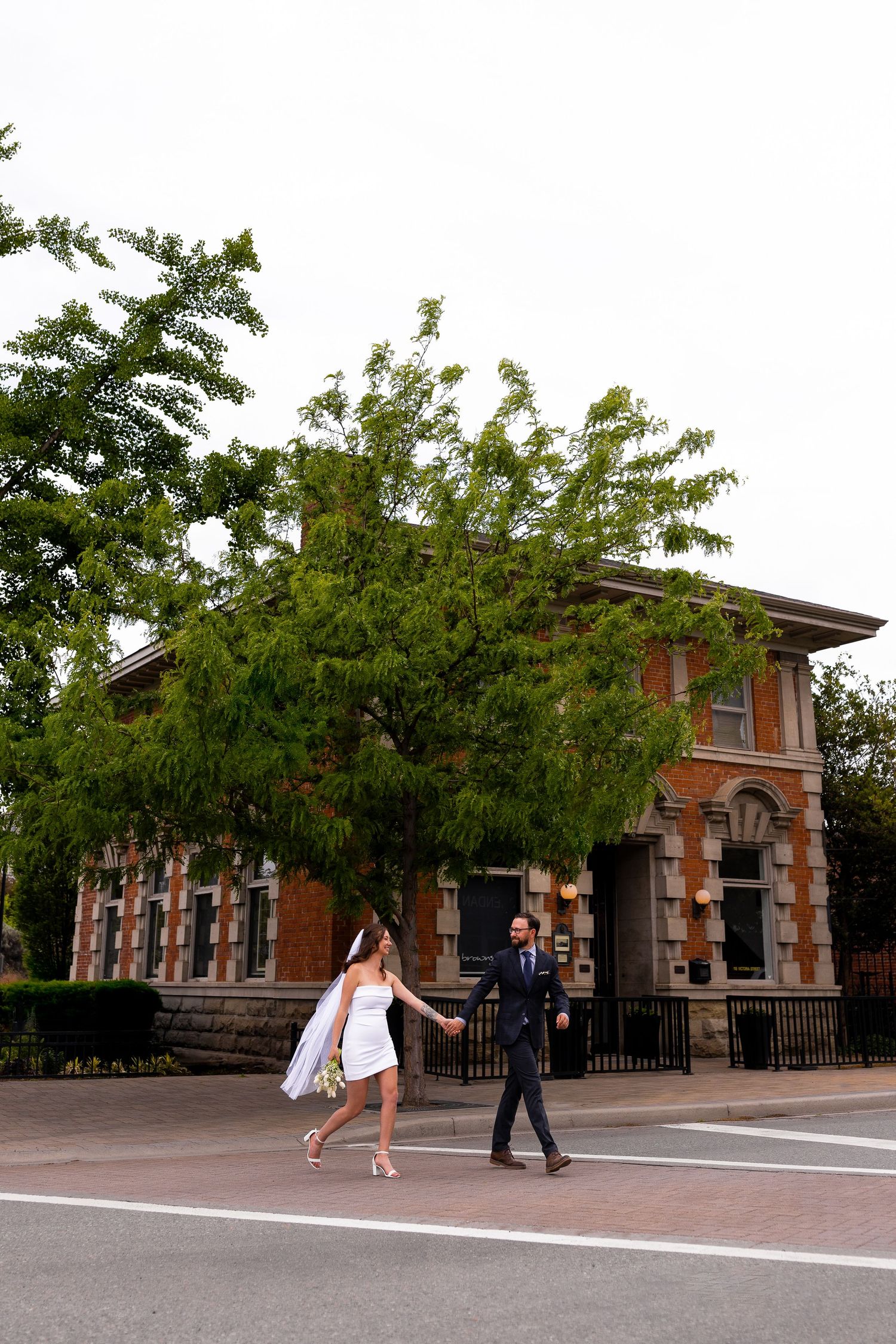 Elopement photo taken downtown Kamloops BC featuring Brownstone restaurant.