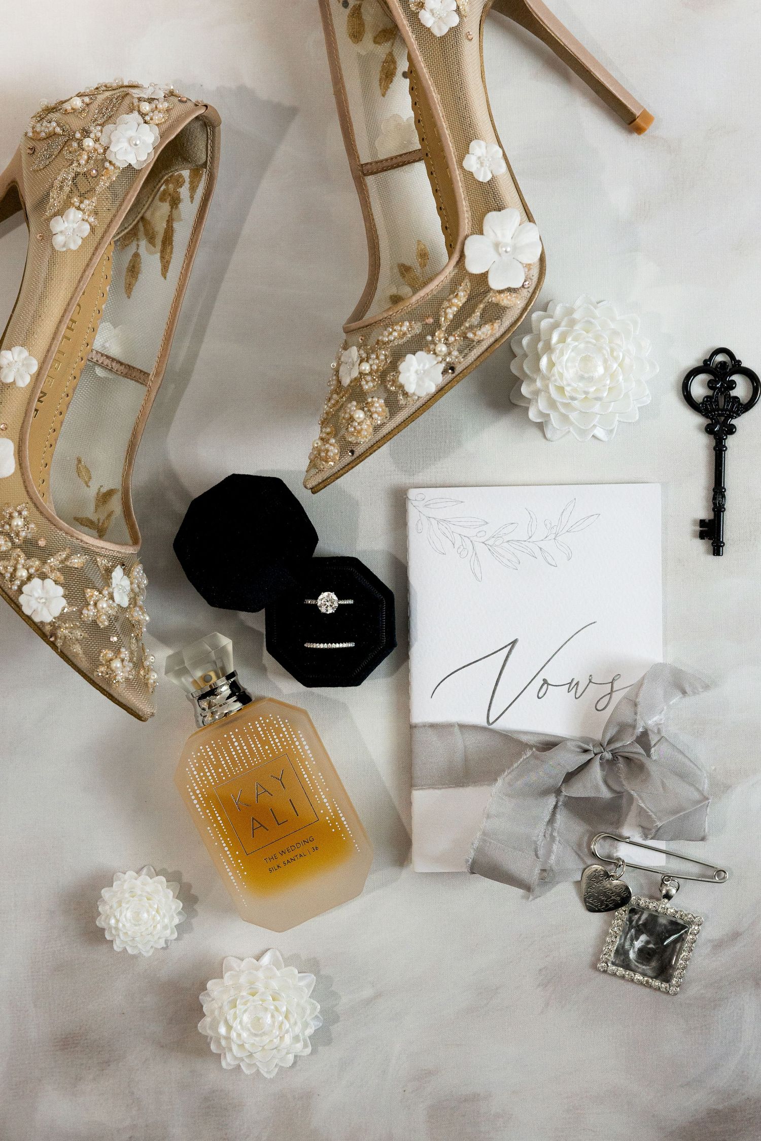 Wedding detail flat lay of bride’s accessories in Grande Prairie, capturing stylish rings, shoes, and elegant bridal preparation photography