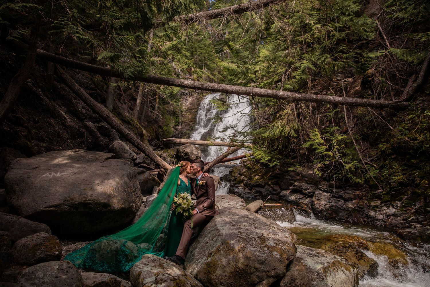 Elopement photo taken at Whitecroft Falls, near Sun Peaks BC.