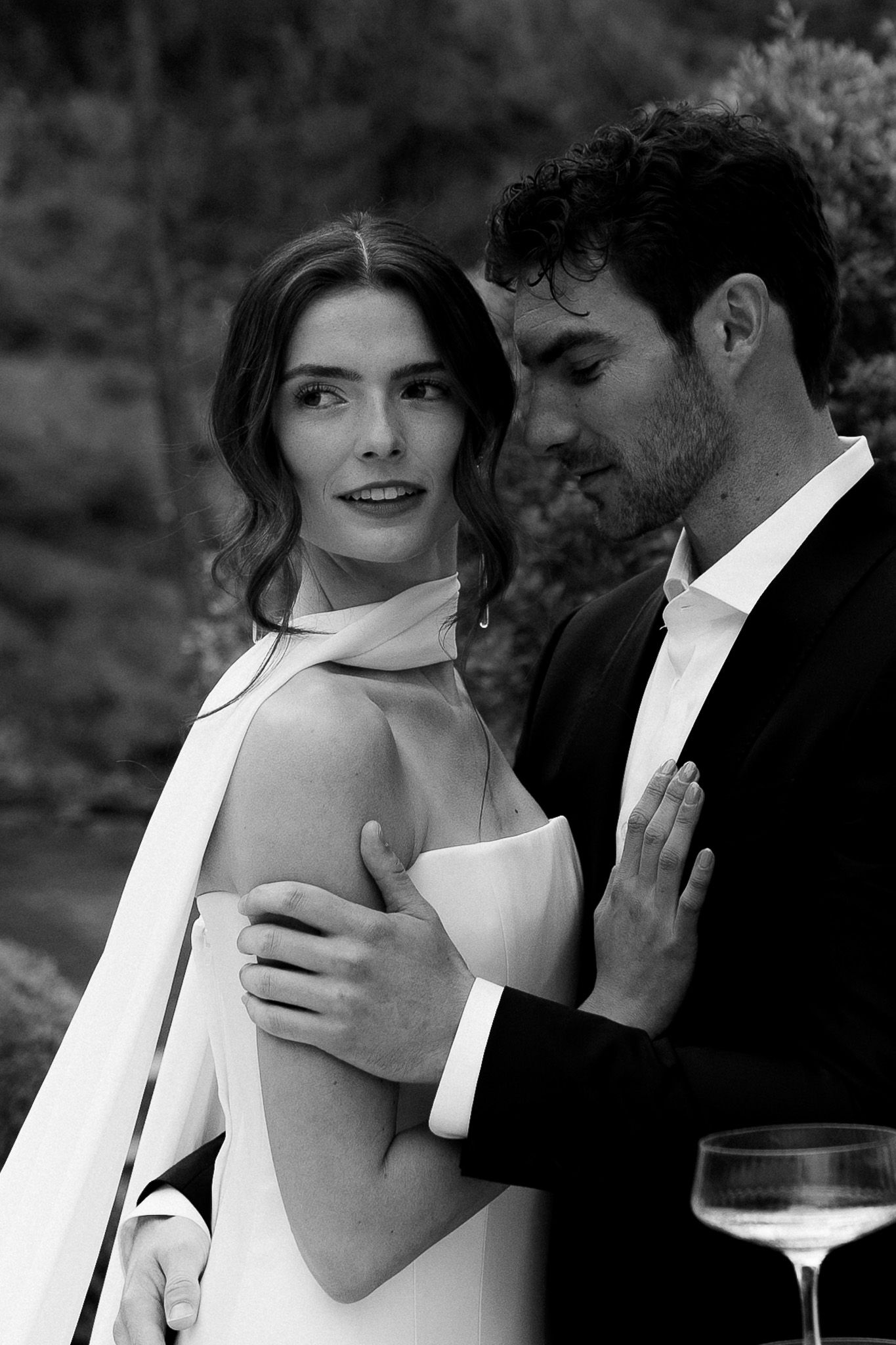 Black and white luxury wedding photo of couple sharing intimate moment in Kelowna BC, capturing romantic and stylish wedding photography.