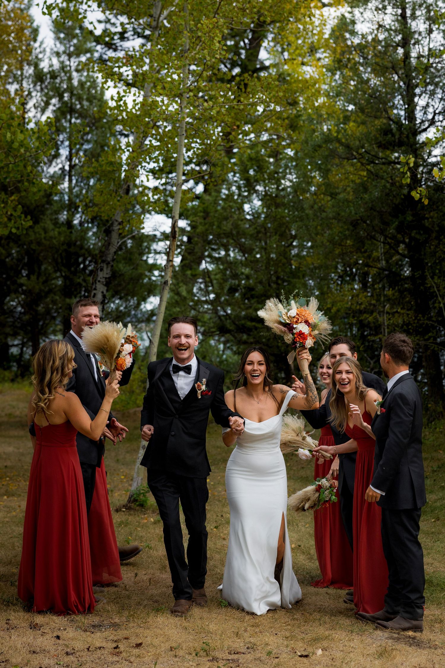 Luxury wedding photo of bride, groom, and bridal party, capturing stylish, joyful, and elegant group portraits for destination weddings.