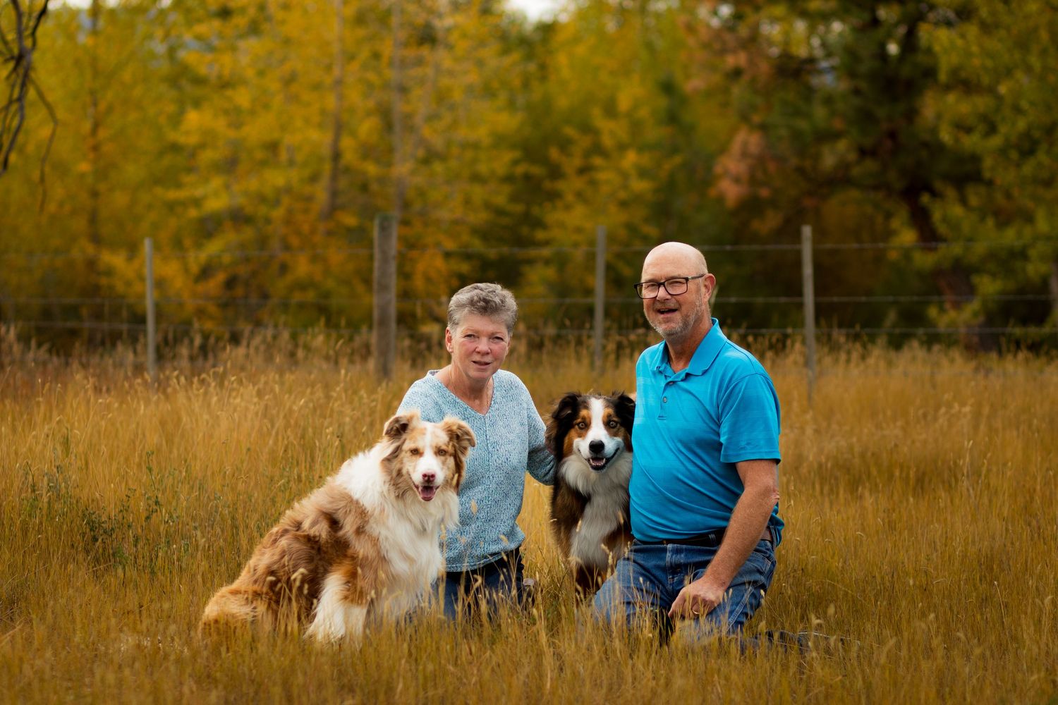Lifestyle family photo of older couple with their dogs, capturing warm, authentic moments in luxury pet and family photography.