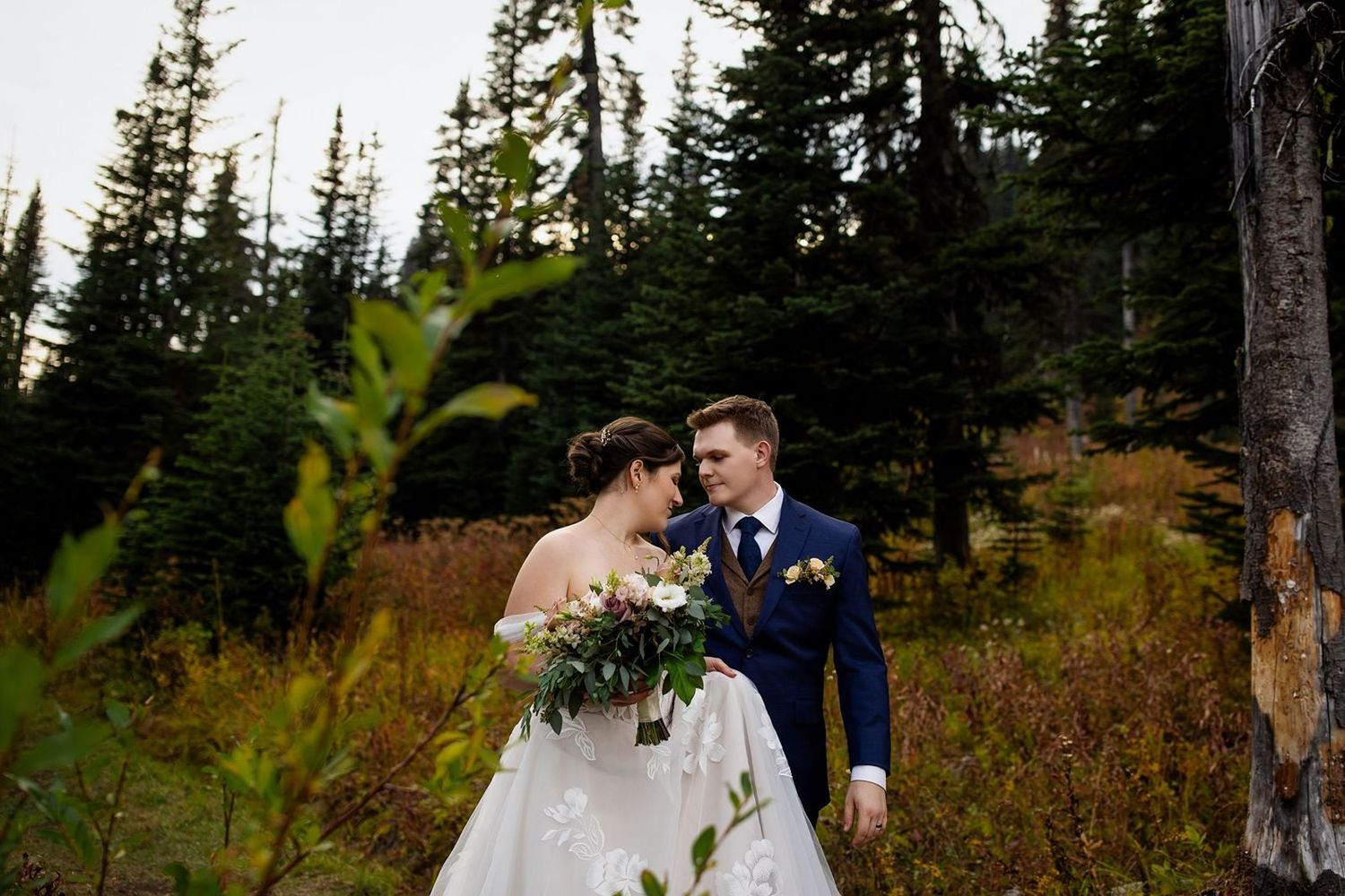 Bride and groom posing in the Okanagan woods