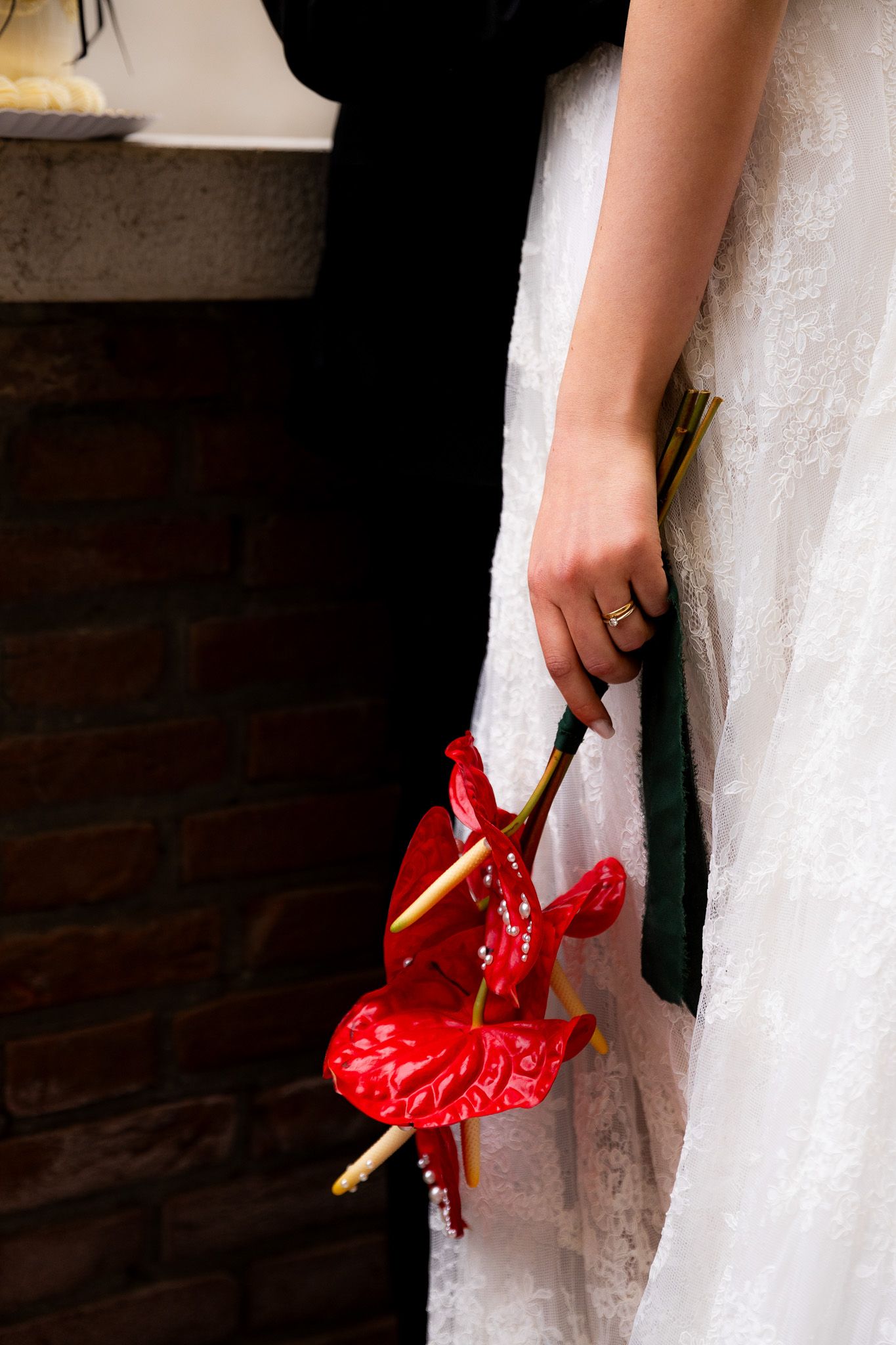 Wedding detail photo of Venetian flowers in bride’s hands, capturing romantic and stylish destination wedding photography in Venice.