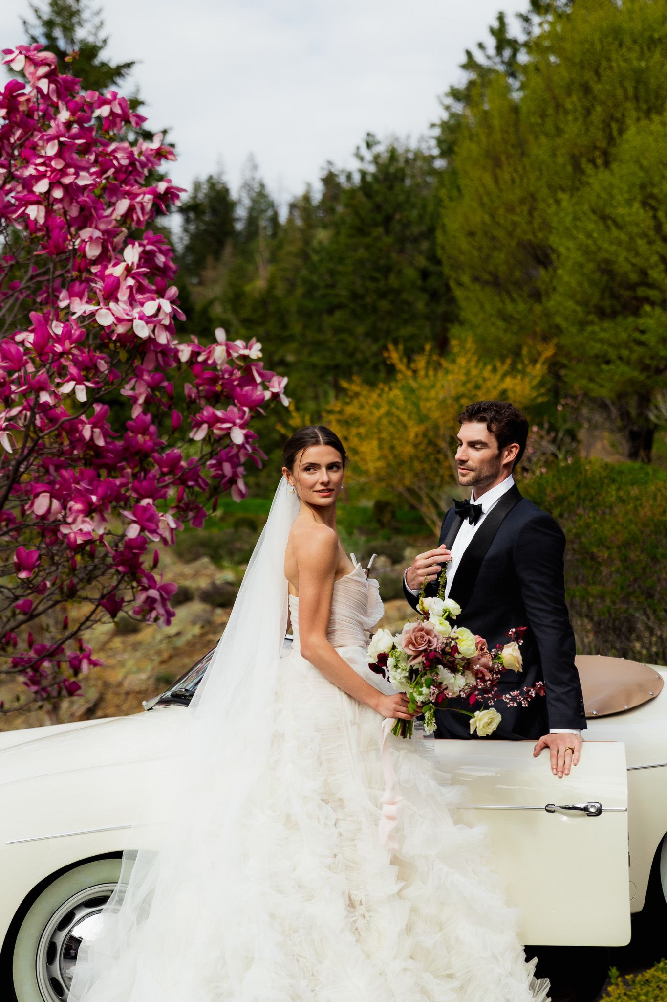 Bride and groom pose for their wedding portraits that showcase luxury and true-to-colour photography.