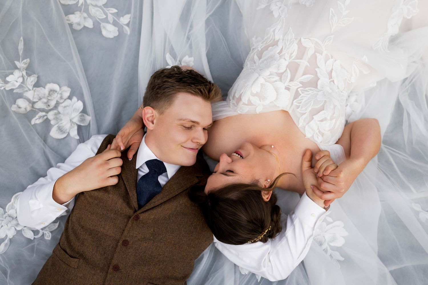 Bride and groom posing for their newlywed portraits at Sun Peaks Resort during their Fall wedding among the mountains in British Columbia.