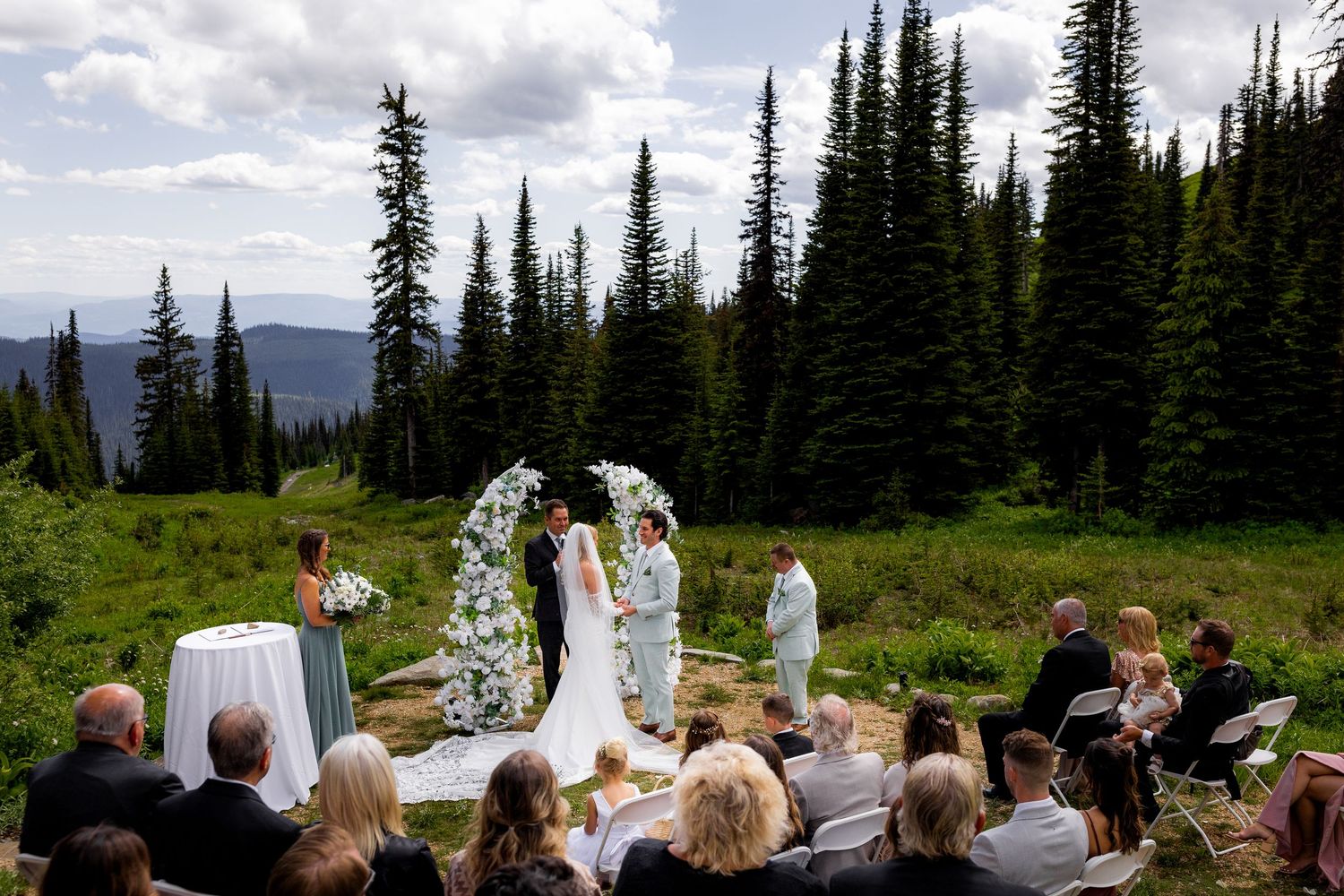 Luxury wide-angle wedding ceremony photo at Sun Peaks Resort, capturing elegant, romantic, and stylish destination wedding photography.