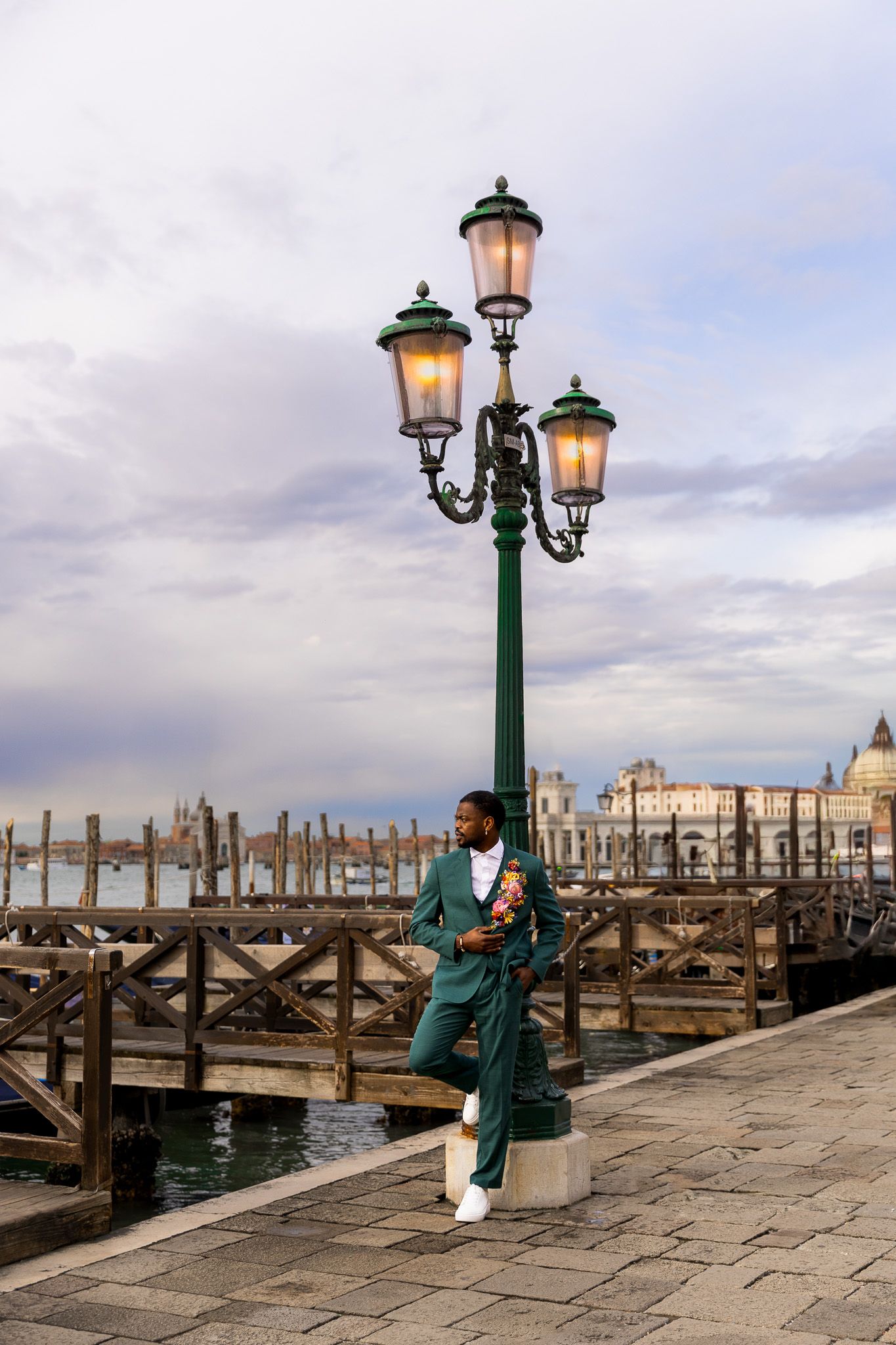 Groom portraits showcasing luxury suit and accessories at his wedding in Venice, Italy.