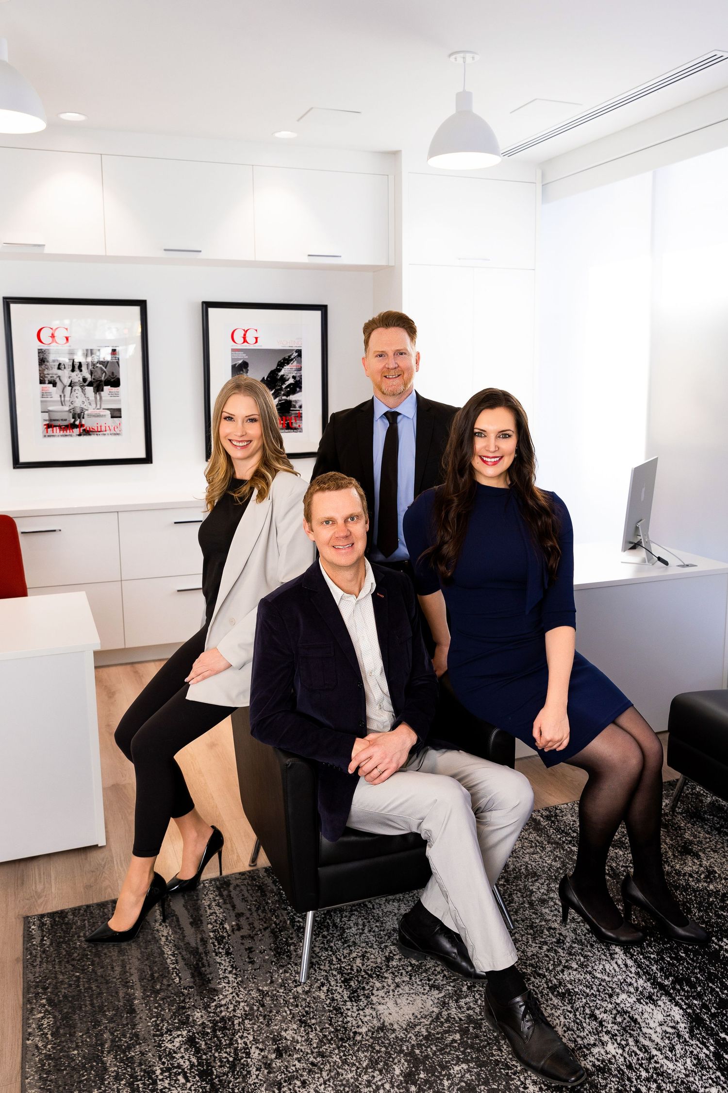 Luxury corporate branding photo of four professionals at Engel & Völkers, styled business portraits showcasing real estate team photography.
