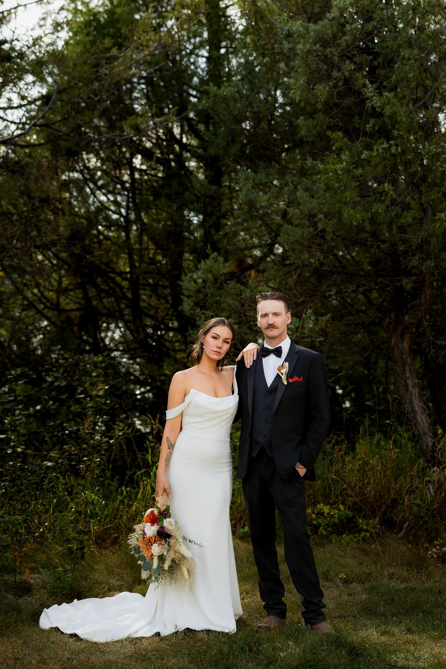 Editorial luxury wedding photo of newlywed couple in Lac La Hache BC, capturing stylish, moody, and romantic destination wedding portraits.