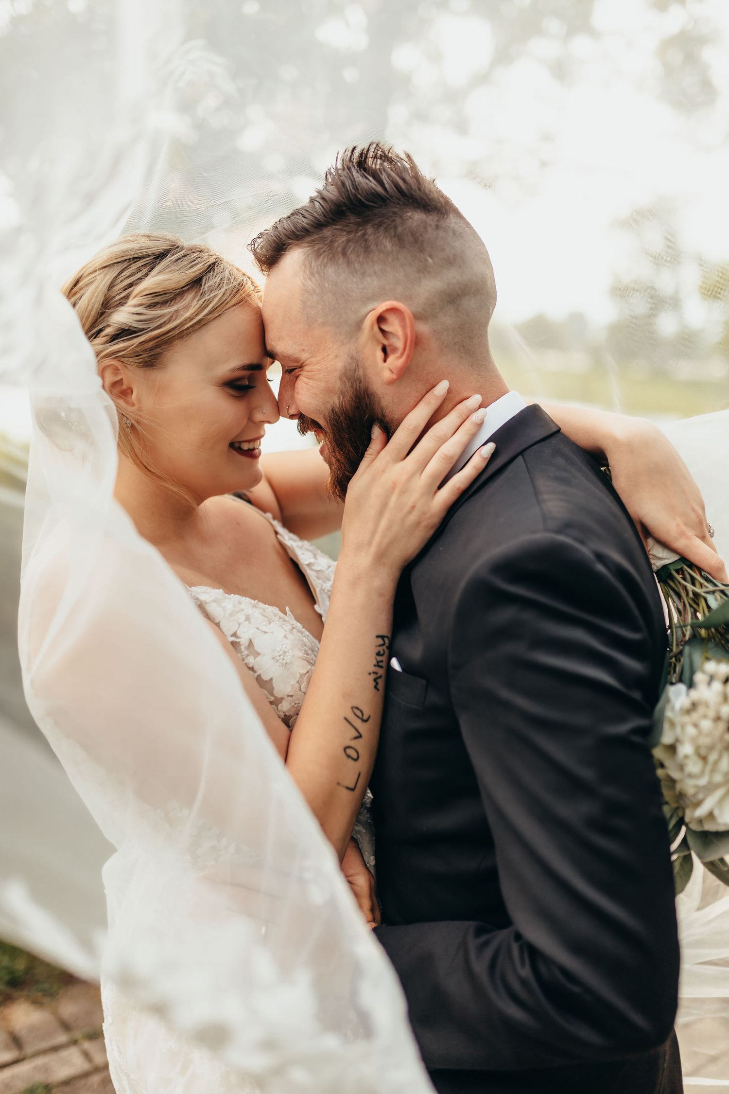 Intimate photography of bride and groom under veil in northwest Indiana wedding