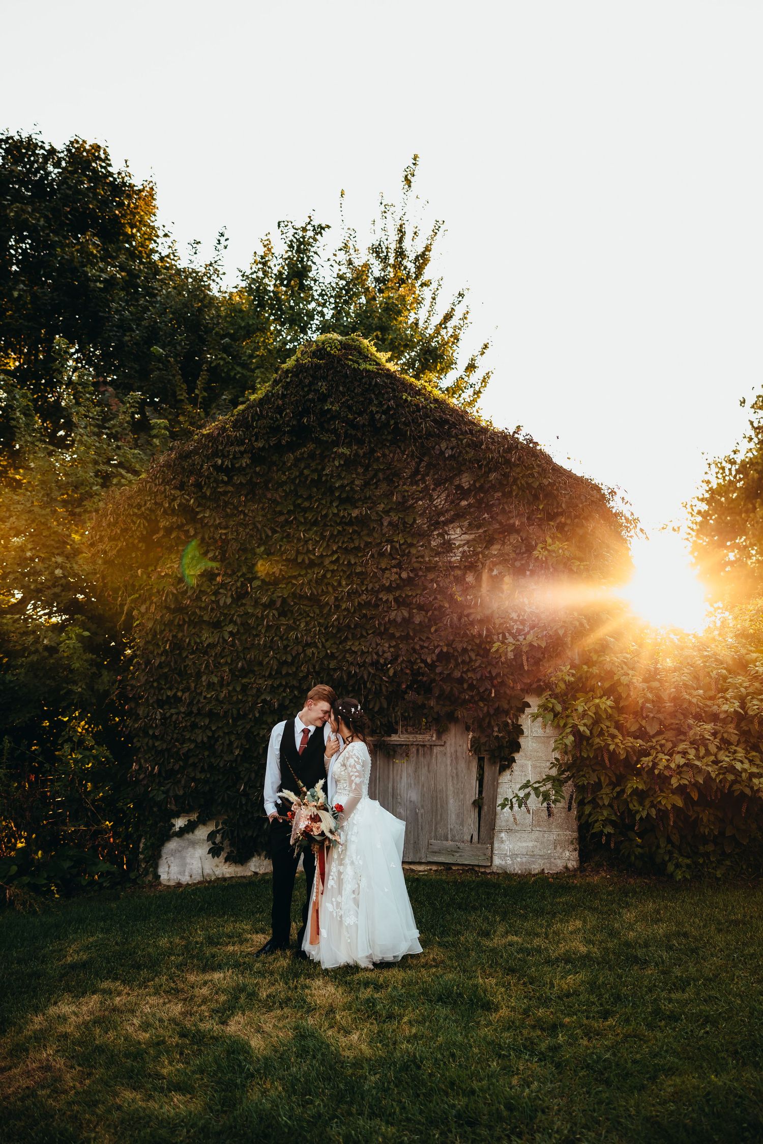 Romantic photography at sunset of bride and groom together at a rustic barn wedding in northwest Indiana.