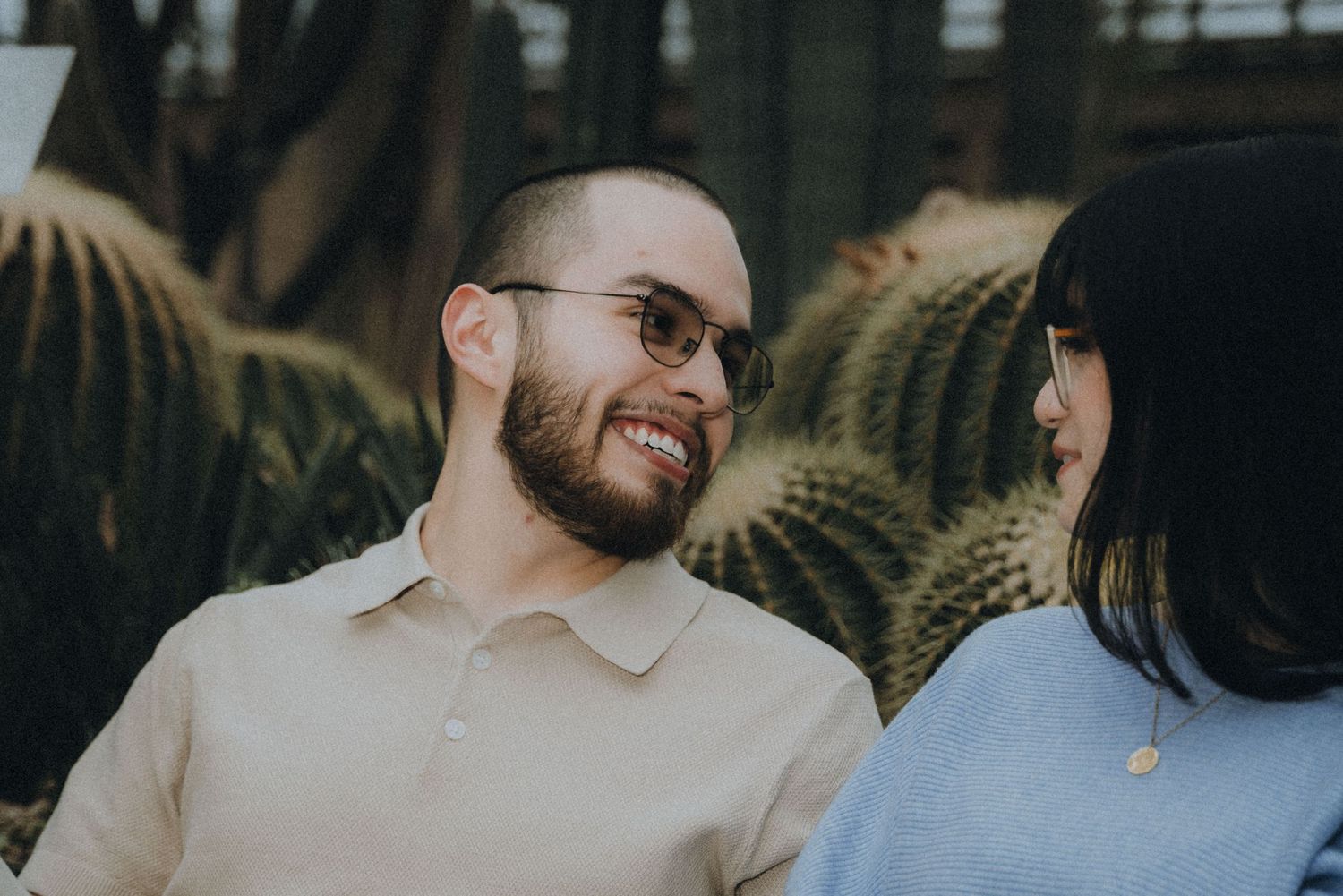 A series of candid moments showing a couple laughing and embracing outdoors during a casual photo session.