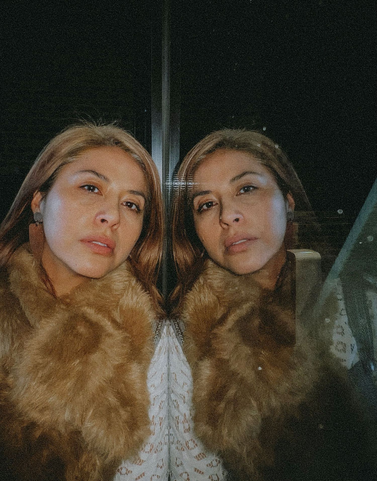 A series of four similar selfie photos taken in dim lighting with warm tones and a cozy aesthetic.