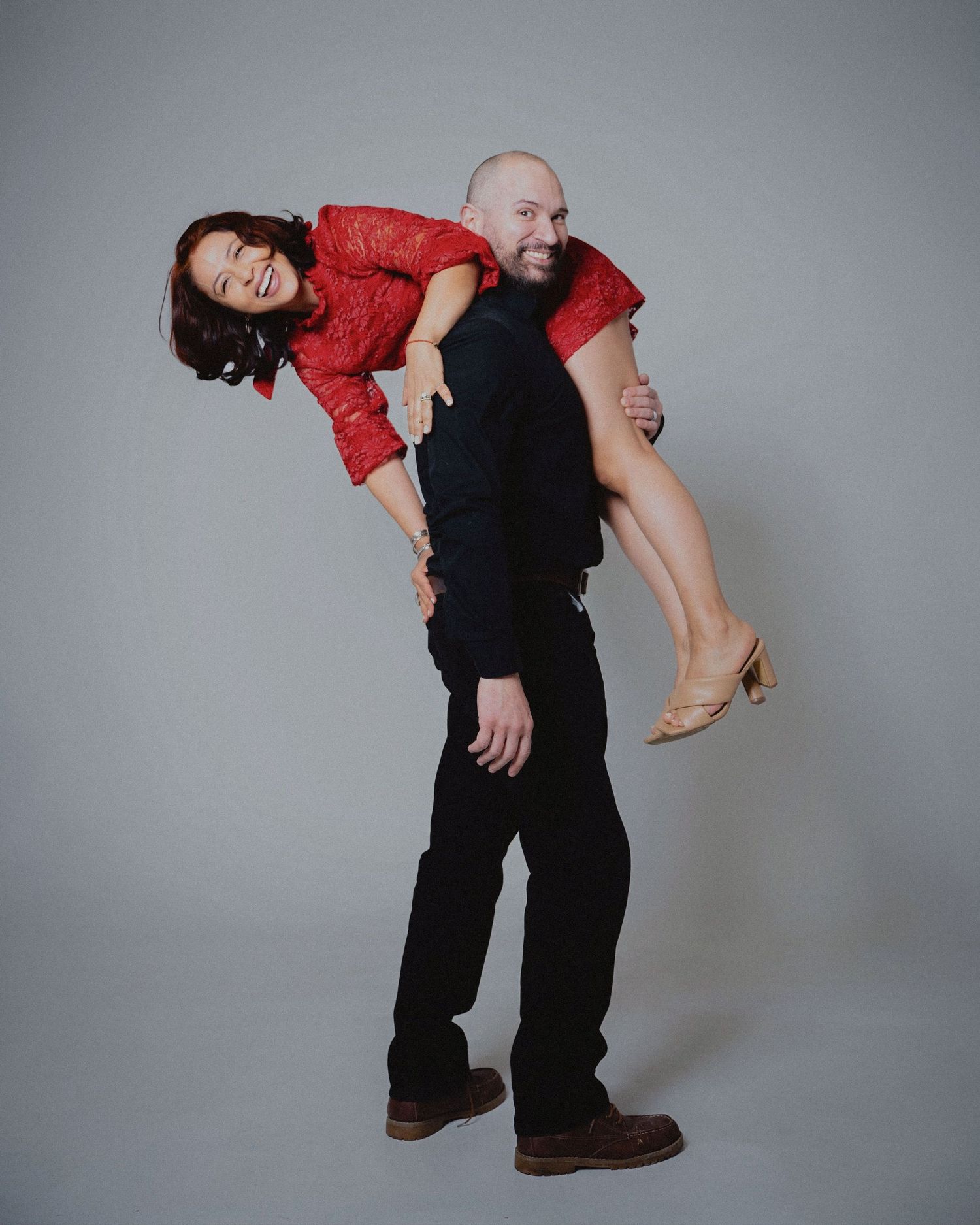 A series of dance poses showing a person in red and black clothing performing dynamic movements against a gray backdrop.